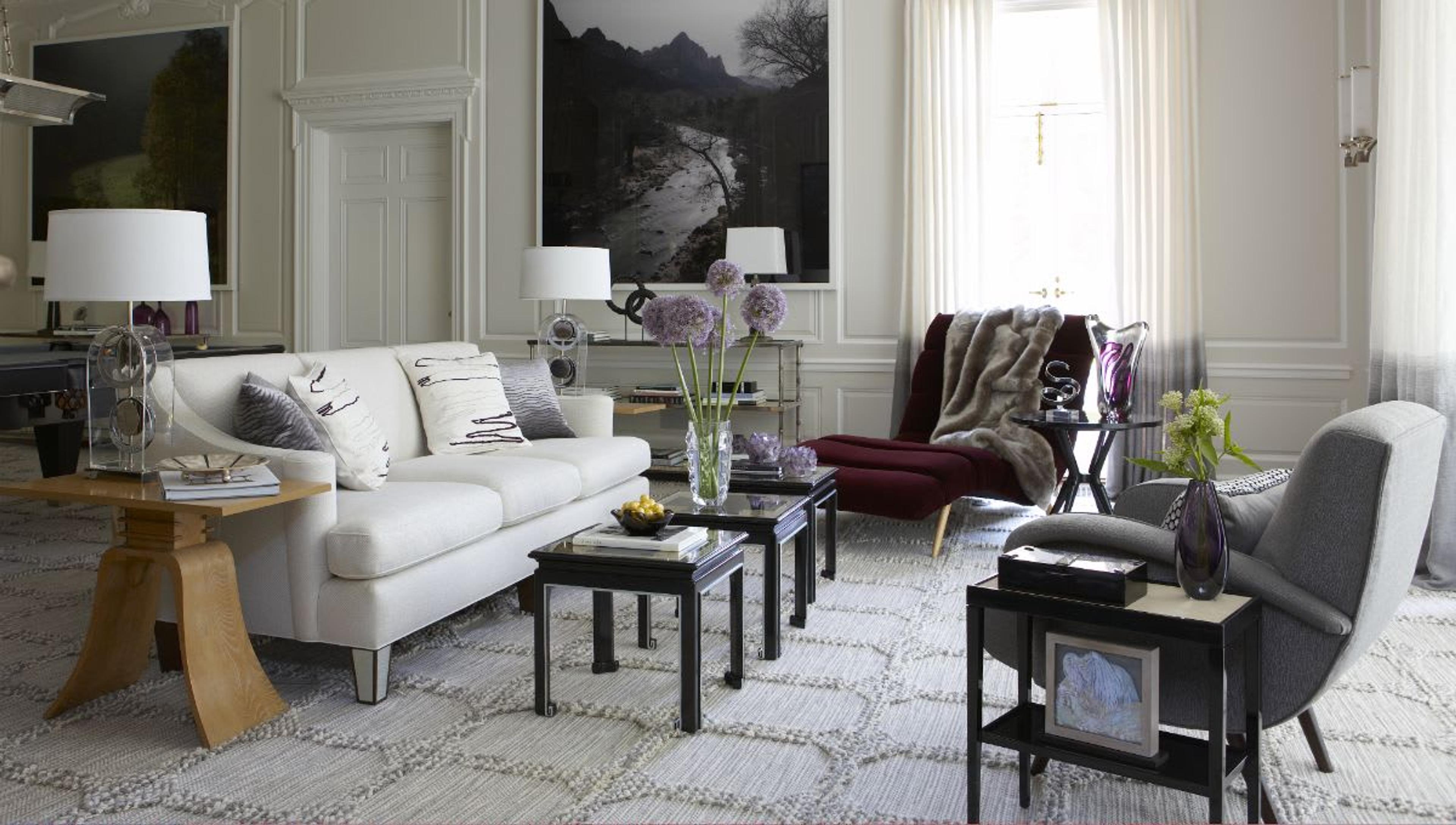 New York apartment luminous living room on the shades of grey featuring contemporary seating and lighting.