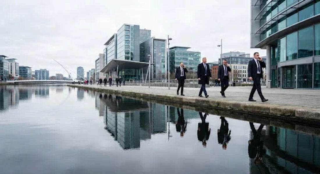 Vigilant close protection team escorting executives along the Dublin docklands