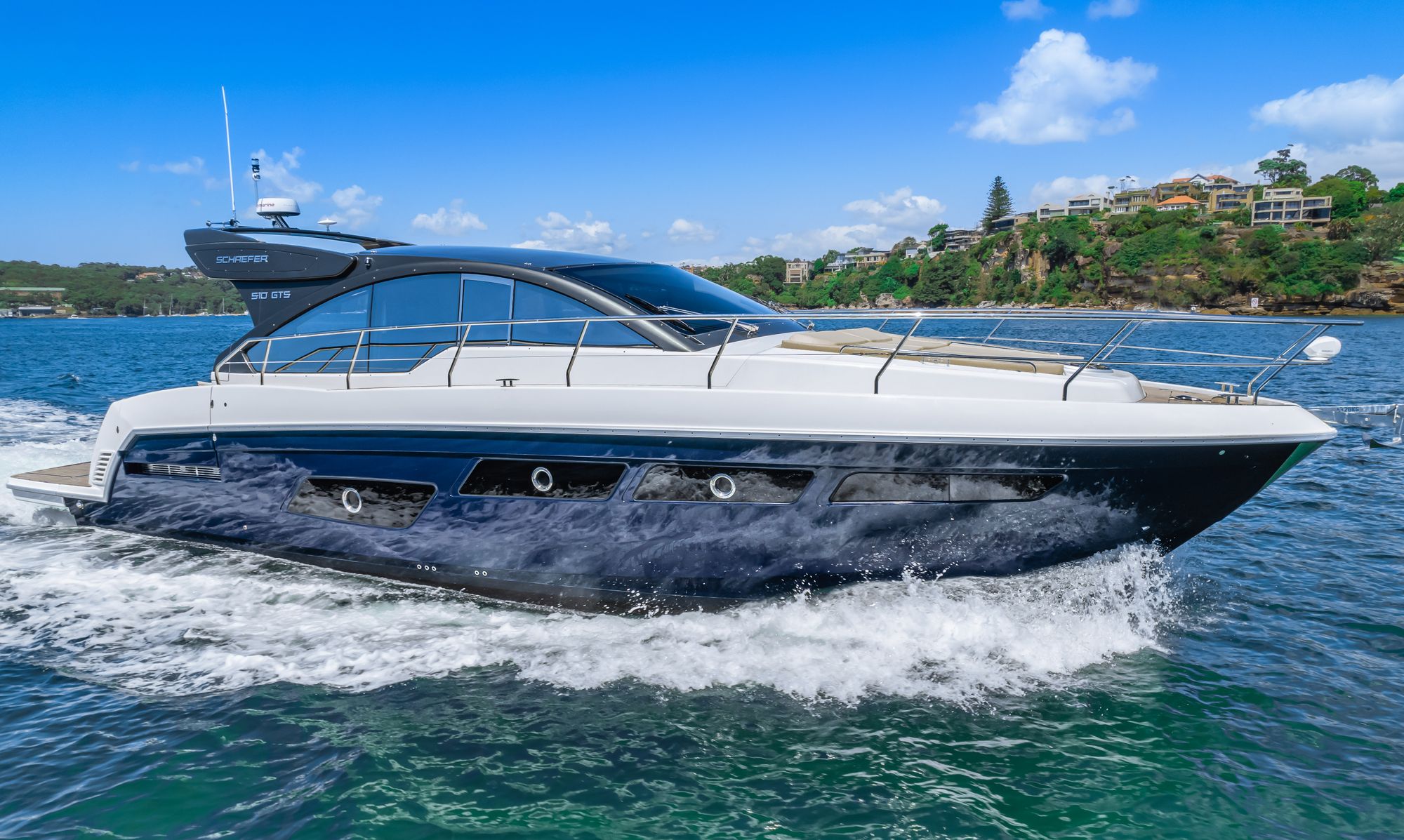Schaefer 510 GTS at speed along a Sydney Harbour foreshore