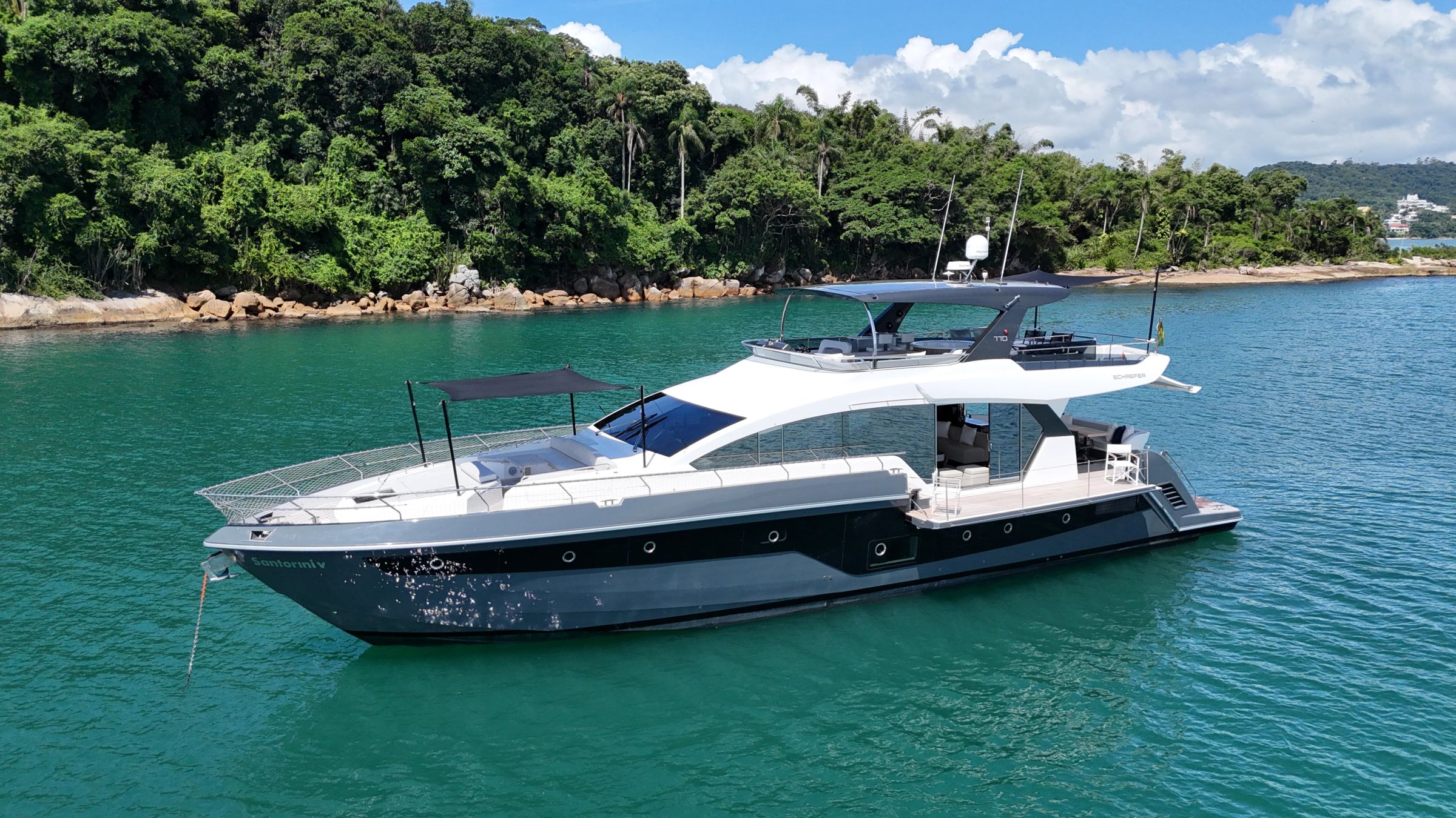 Schaefer 770 flybridge yacht at anchor
