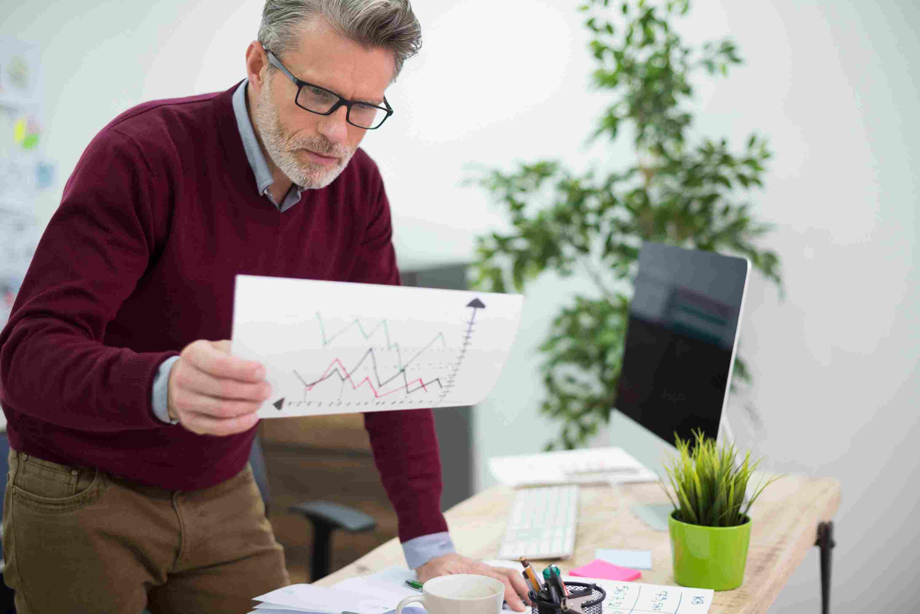 Merchant analyzing data trends to eliminate unproductive vanity metrics.