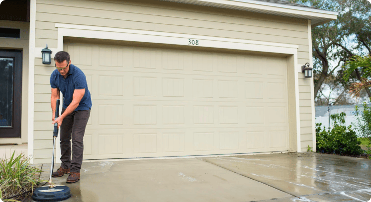 Homeowner using lawn and gardening equipment with extended warranty benefits improving sales performance.