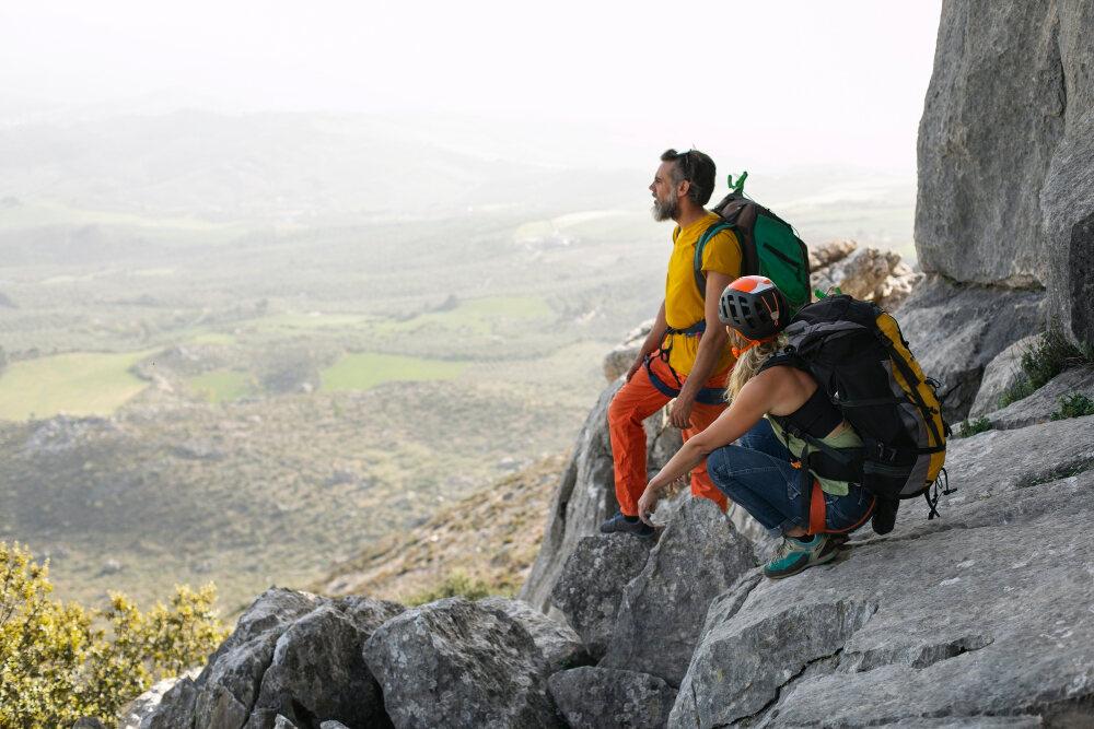 Outdoor enthusiasts hiking with protected gear showing customer confidence in recreation warranties.