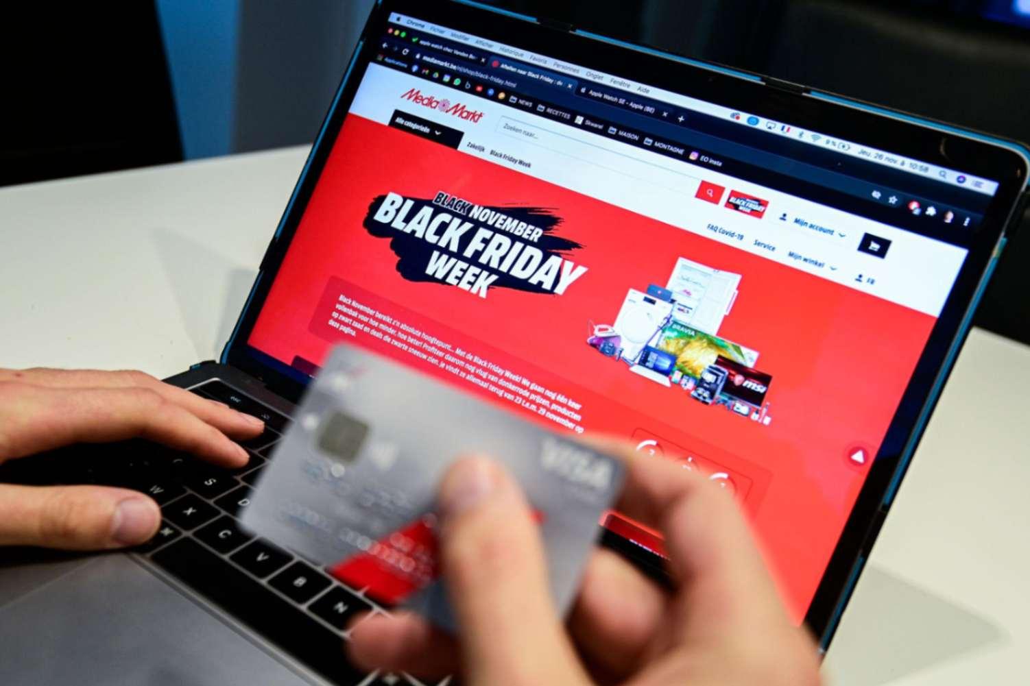 Shopper rushing through a Black Friday checkout, the kind of speed that can let a fraudulent order slip past merchant review
