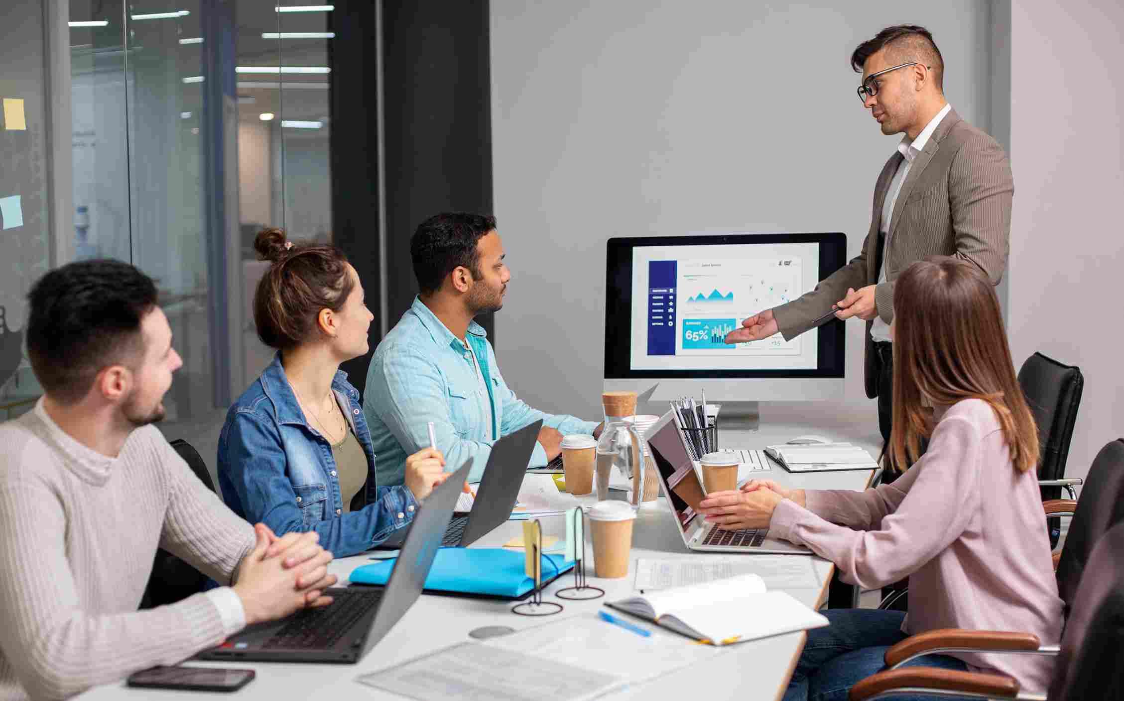 Team strategizing e-commerce growth with data-driven insights and analytics presentation.