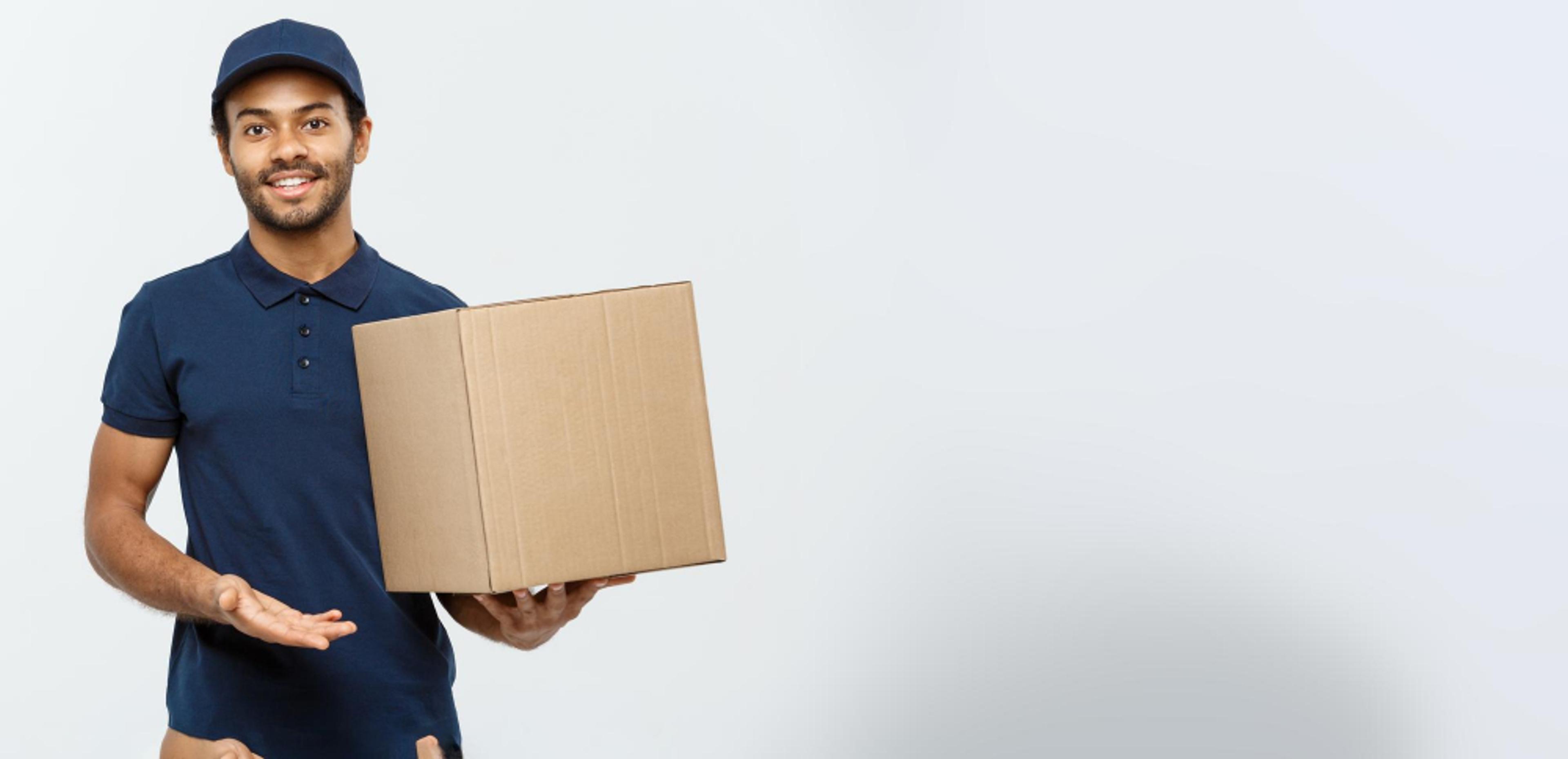 Delivery professional holding a package - representing how furniture retailers boost profits and customer trust with SureBright shipping insurance.