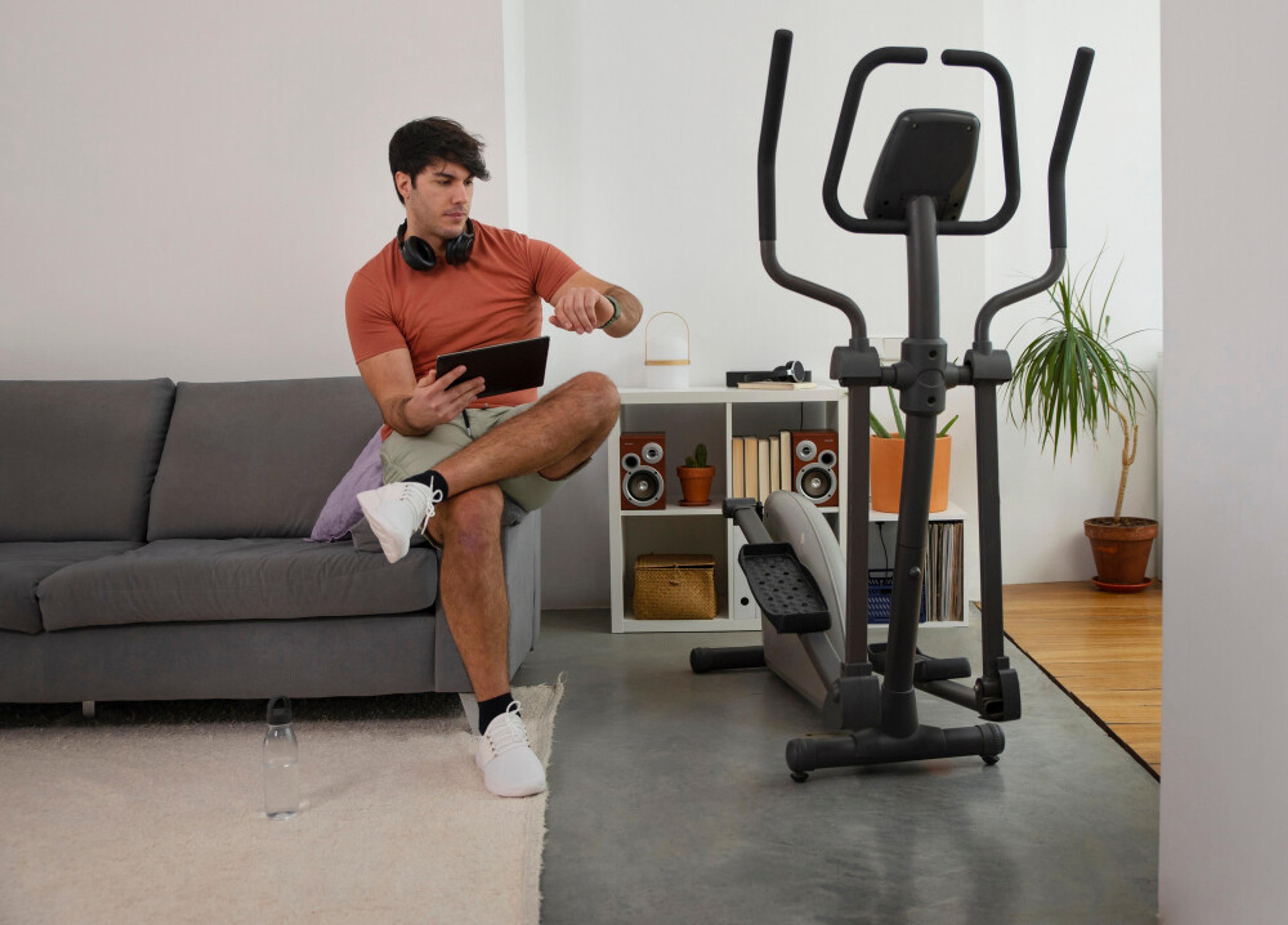 Customer exercising on indoor bike with fitness equipment warranty and protection plan benefits.