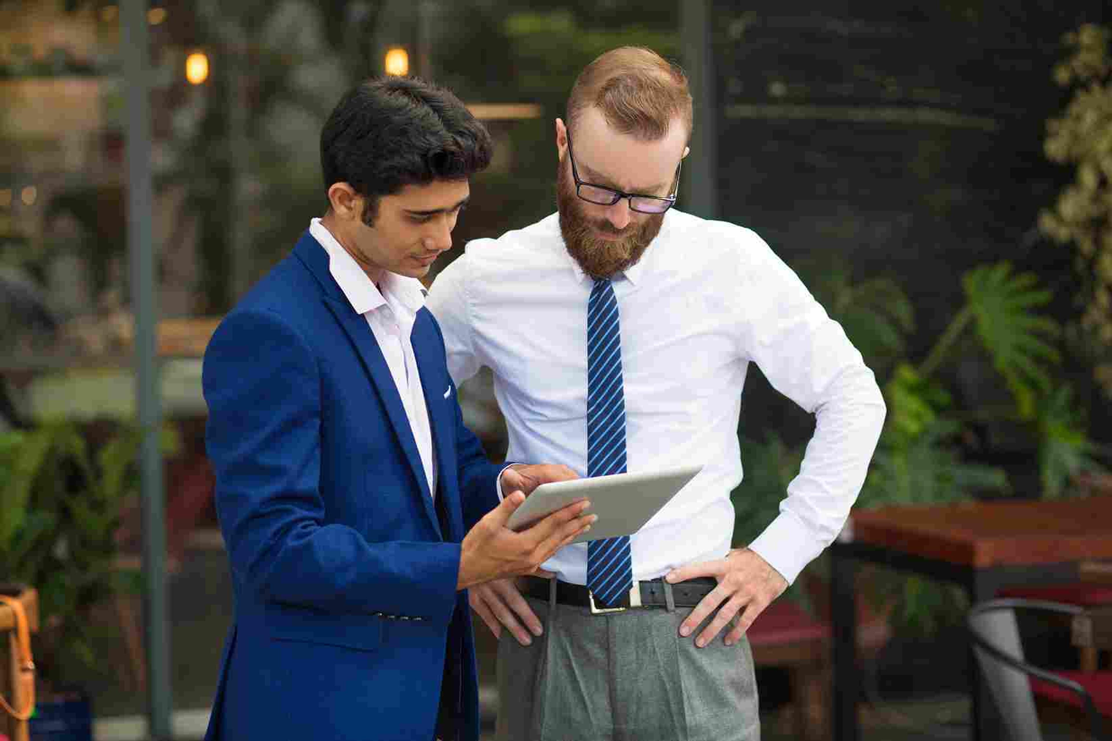 Professionals analyzing Pinterest metrics to track buyer intent in 2025.