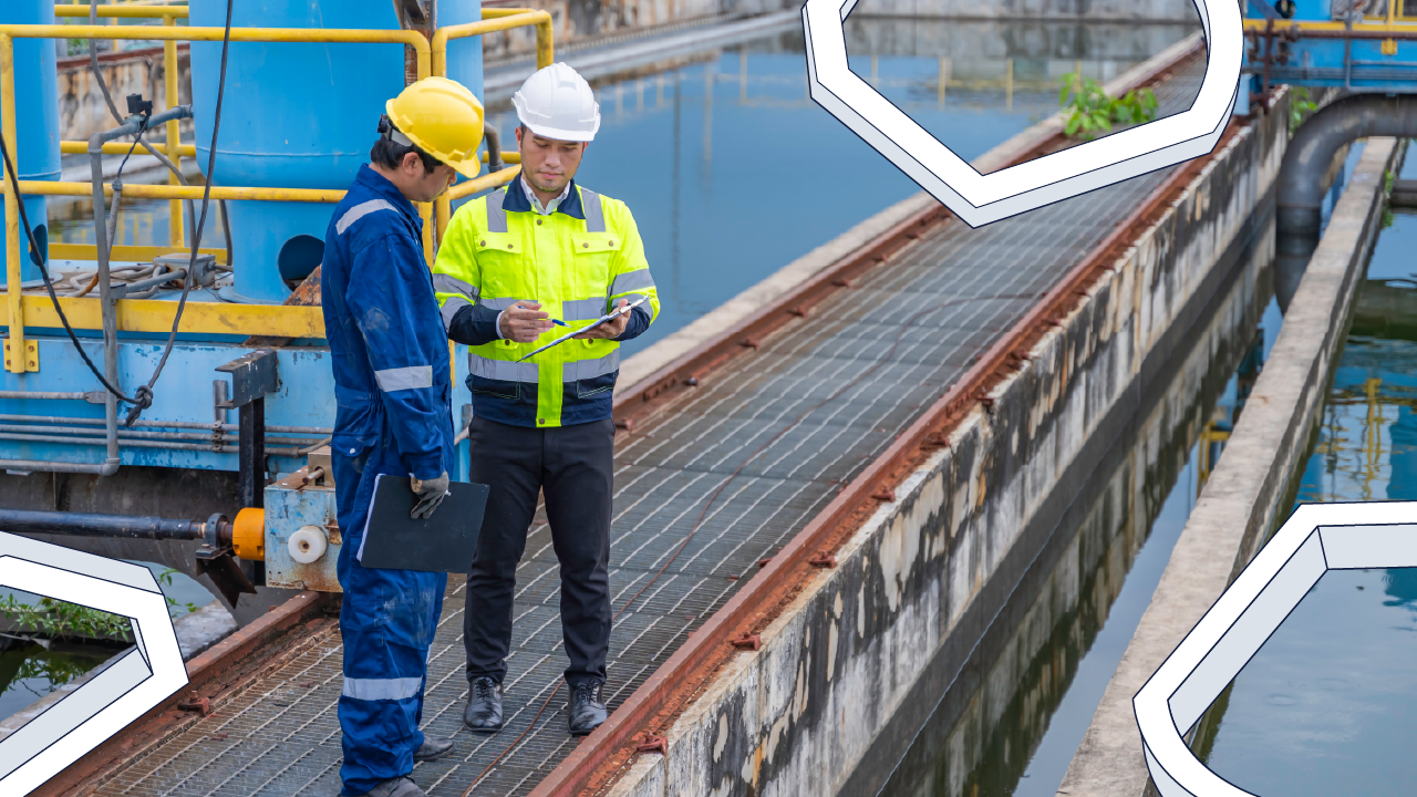 Two individuals in hard hats working at a water utilities plant