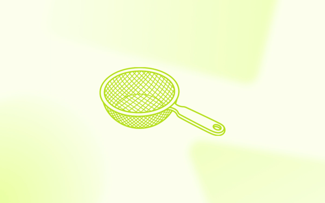 A handheld mesh strainer, illustrating how ad creative filters and targets the ideal audience within broad Meta campaigns.