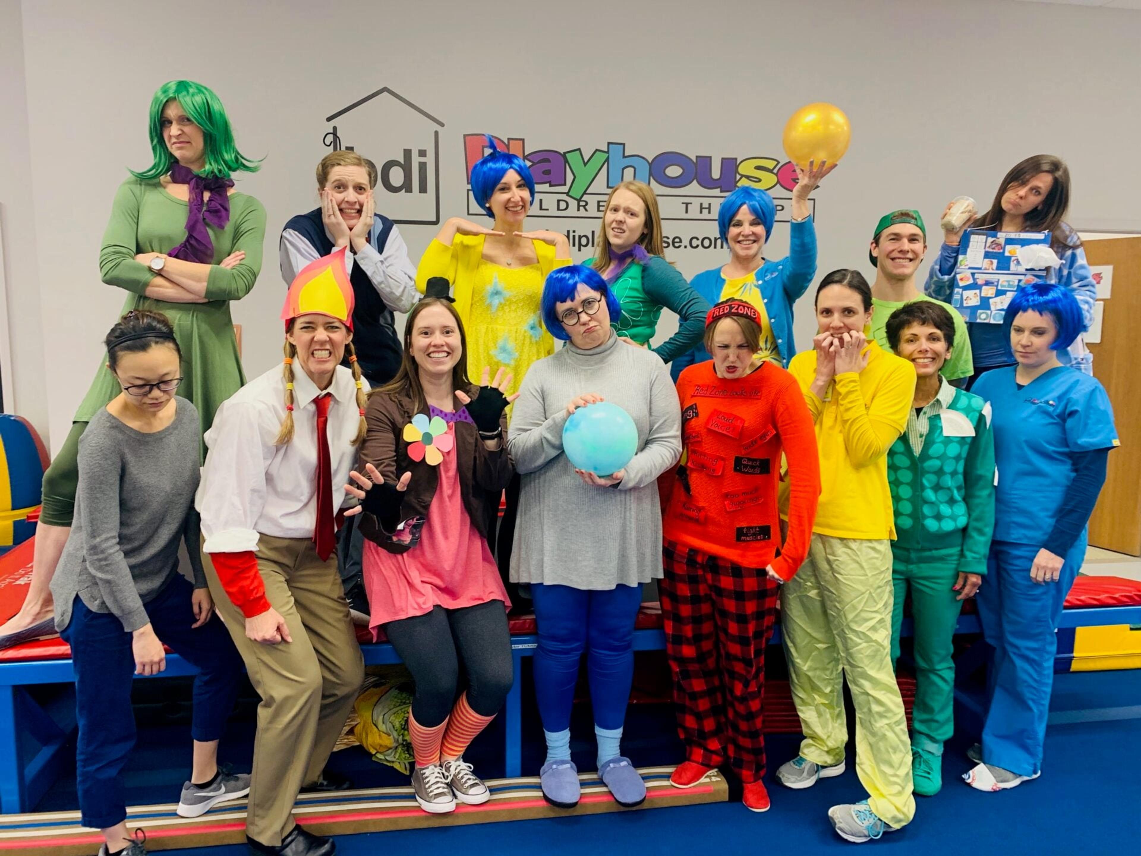 BDI Playhouse staff pose in colorful Inside Out character costumes for Halloween