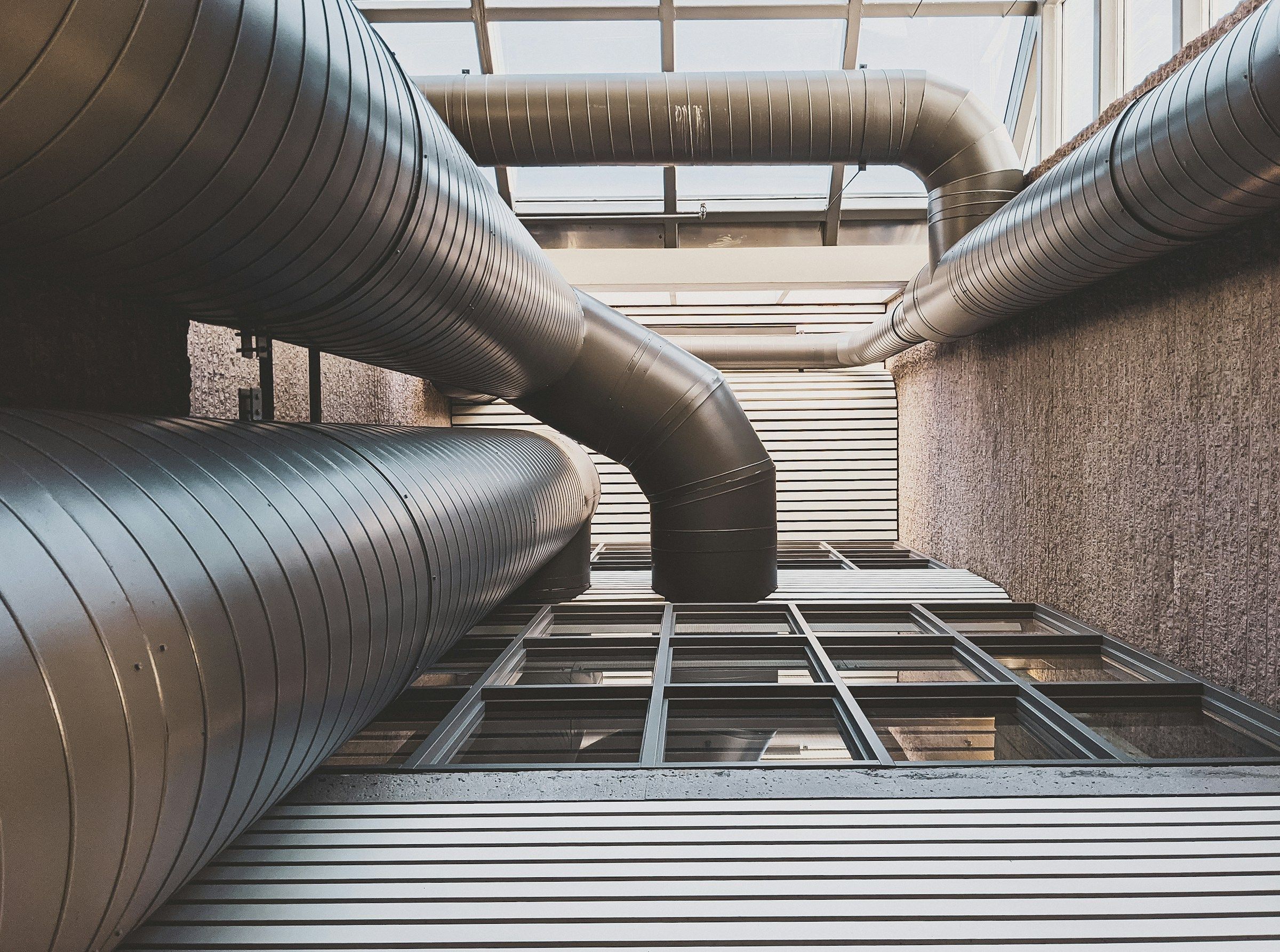 Exposed ventilation ductwork running through a building