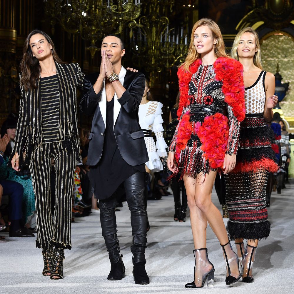 Olivier Rousteing on Balmain runway with models 