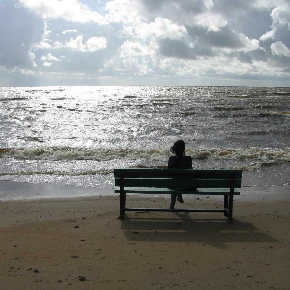 Woman sitting on beach