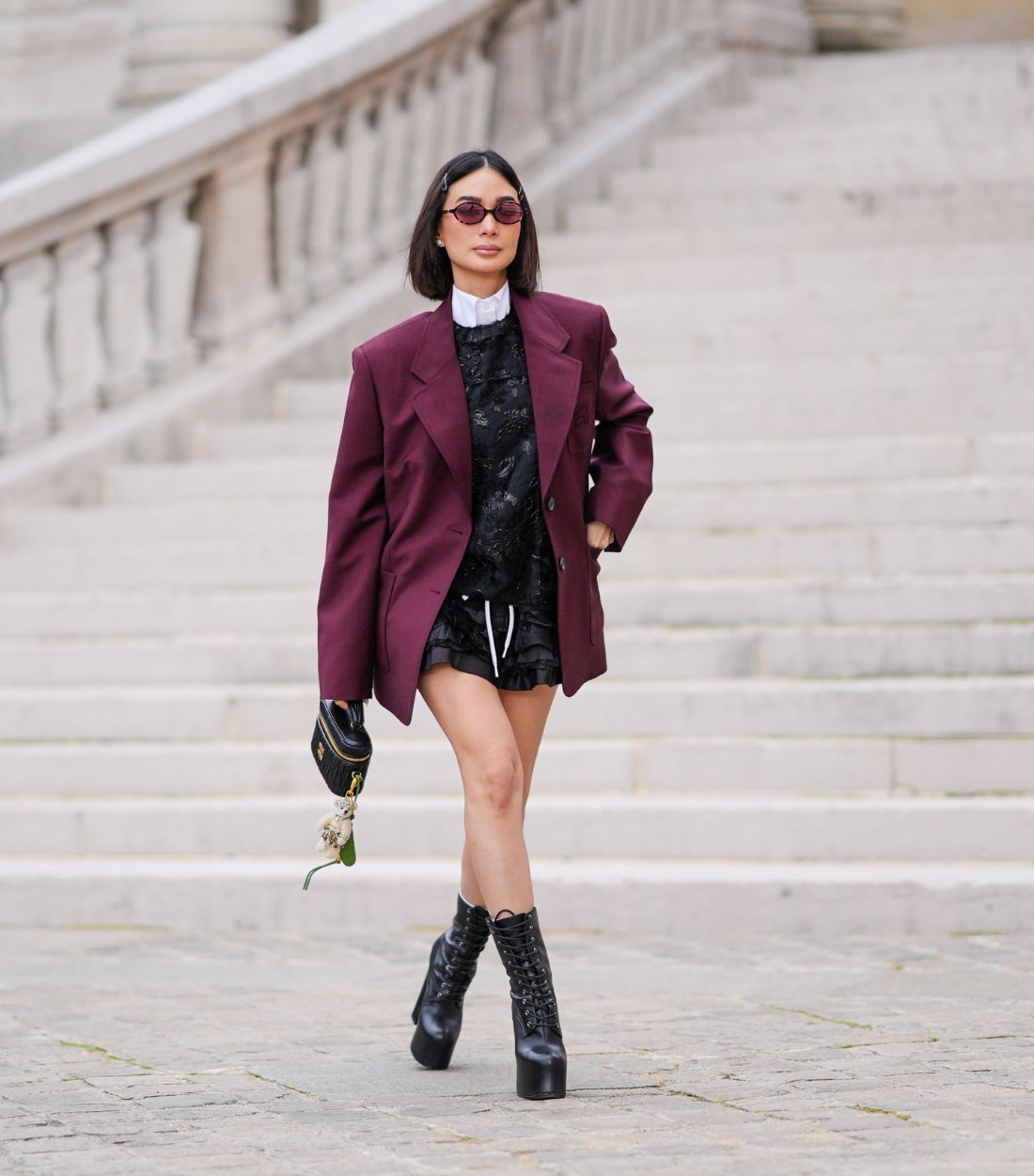 Woman wearing black dress with black boots