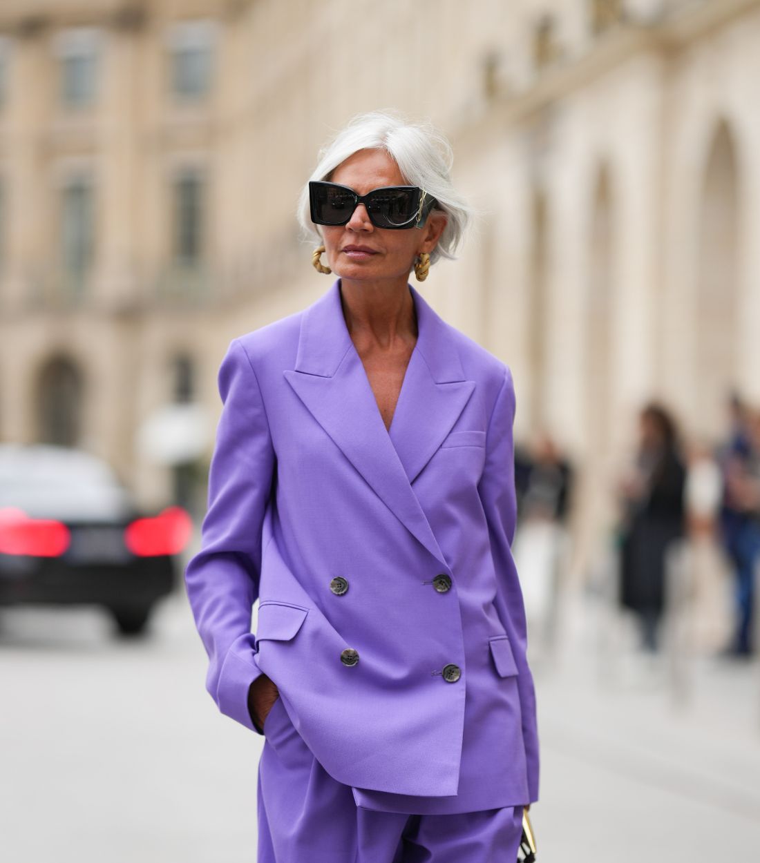Grey haired woman in purple suit street style 
