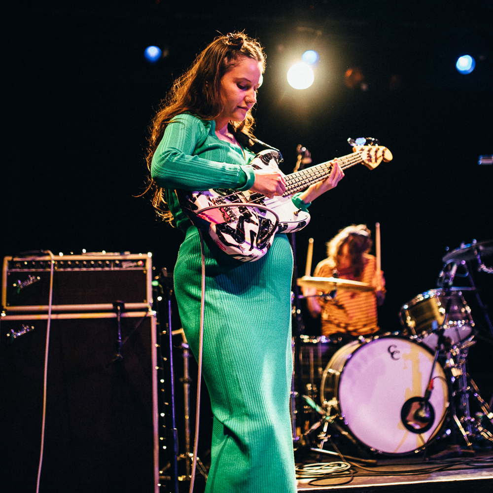 Kelly Hellmrich of Camp Cope performs on stage while pregnant