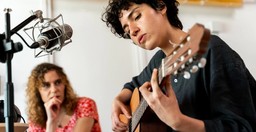 Two persons playing music