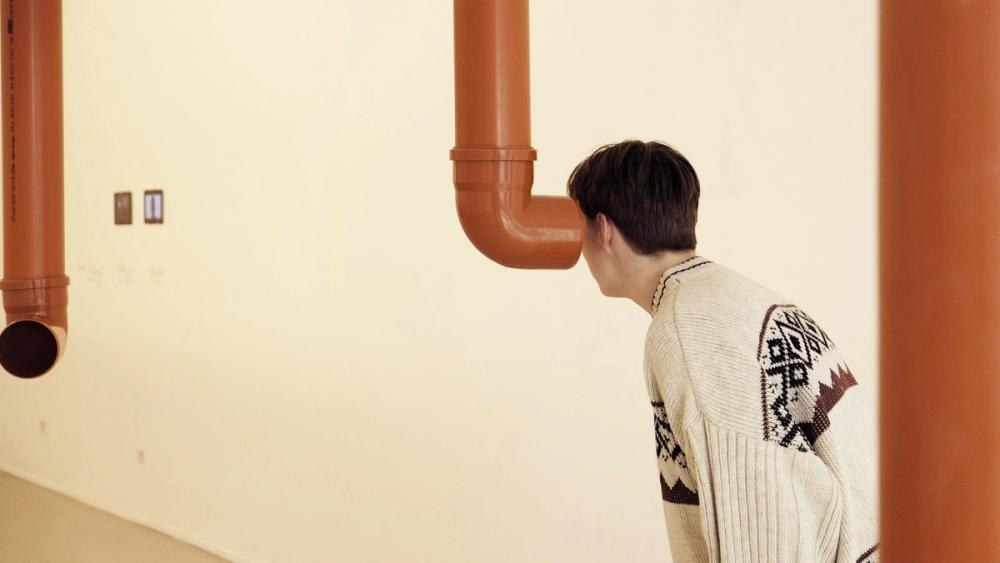 Detail from: Amol K. Patil, 'Mosquito speaking with Machine', 2023. Photo Cecilia Bautista.  Re-enactment of 'The Fly' by Htein Lin. Stop-motion animated-video projection. Digital print on glass. 3-channel sound. PVC pipes. Dimensions variable.