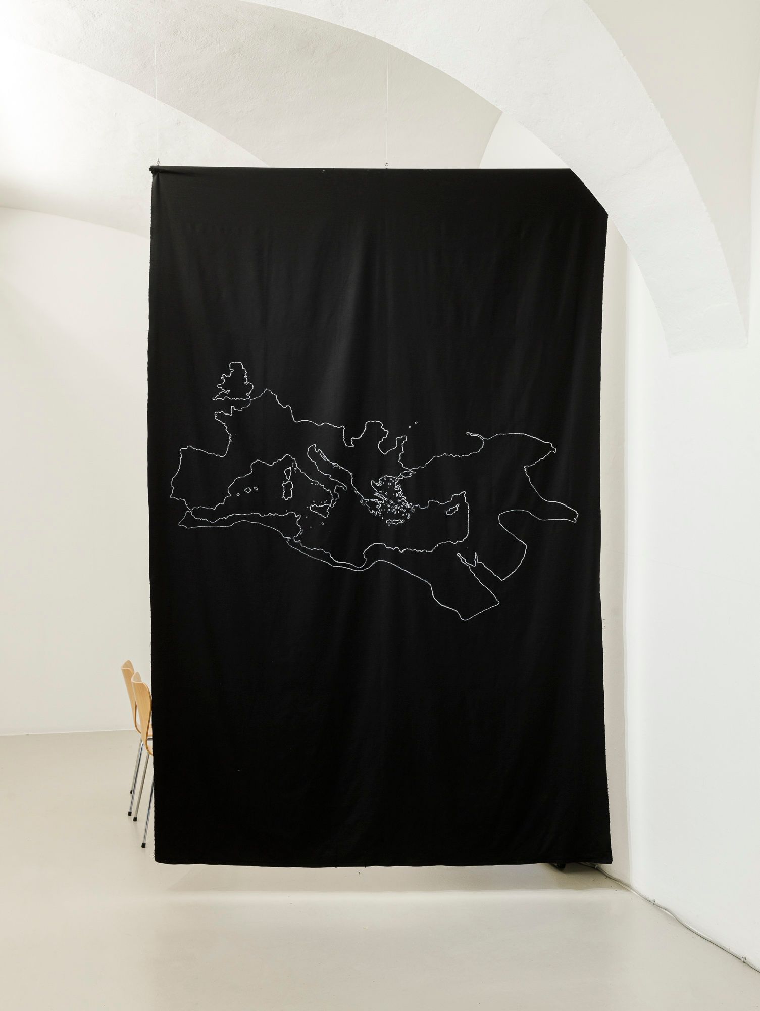 Samia Henni, 'Psychocolonial Spaces - Act 1', exhibition view, Ar/Ge Kunst. Chalk drawing of the Roman Empire in 117 on black cotton fabric.