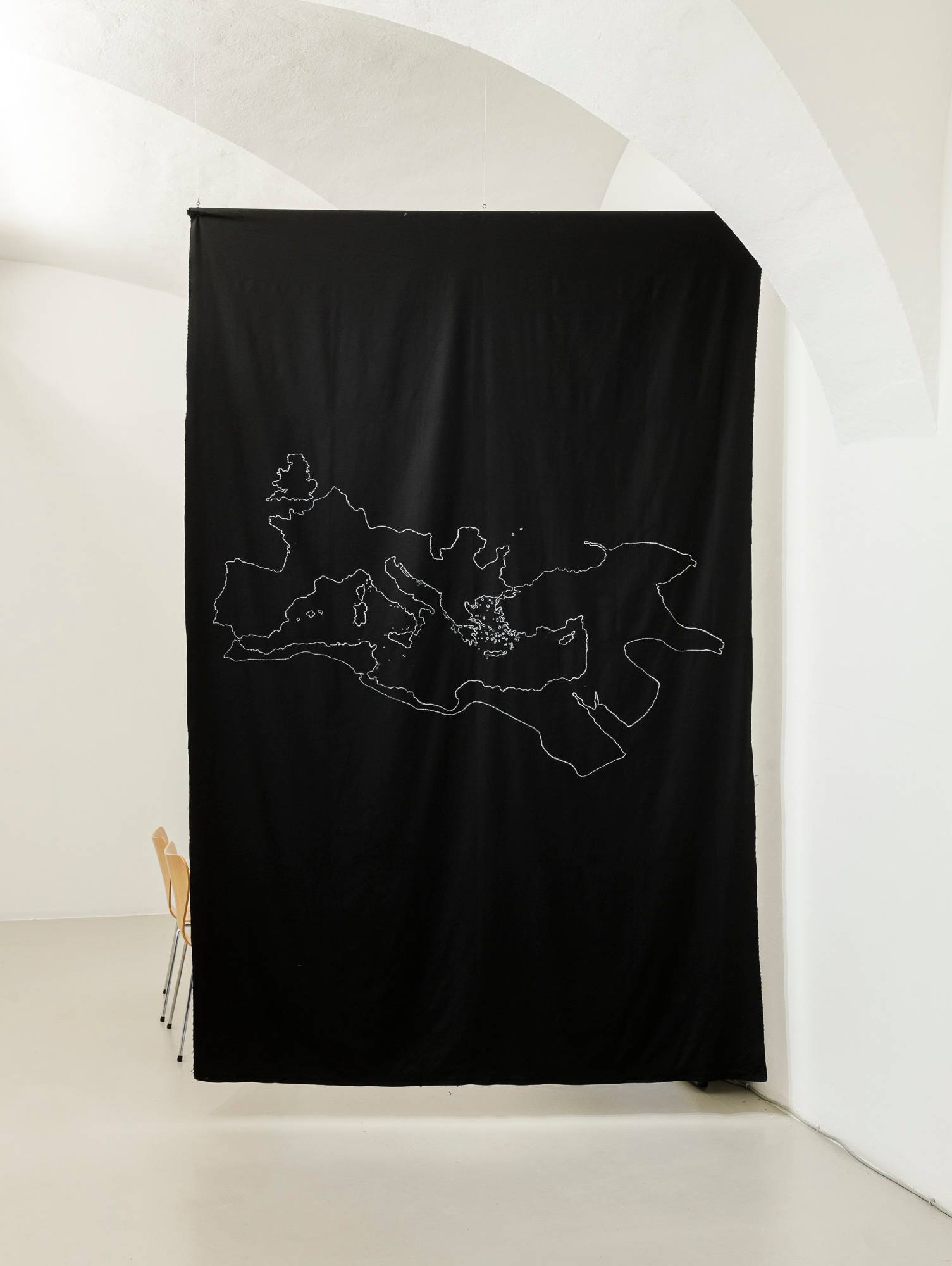 Samia Henni, 'Psychocolonial Spaces - Act 1', exhibition view, Ar/Ge Kunst. Chalk drawing of the Roman Empire in 117 on black cotton fabric.