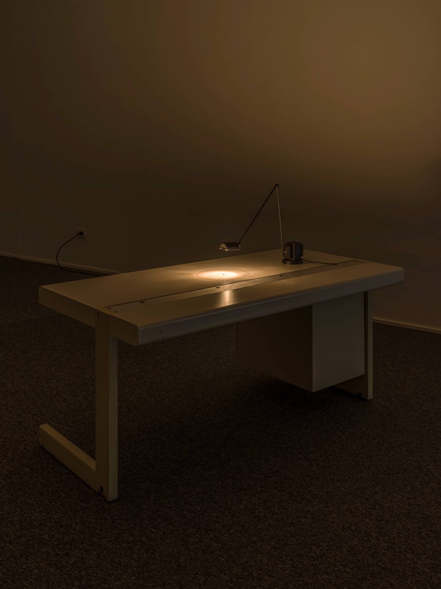 Jonathan Monk, Shine Bright Like a Diamond, 2025. Desk, lamp, diamond and book. Ph. Tiberio Sorvillo.