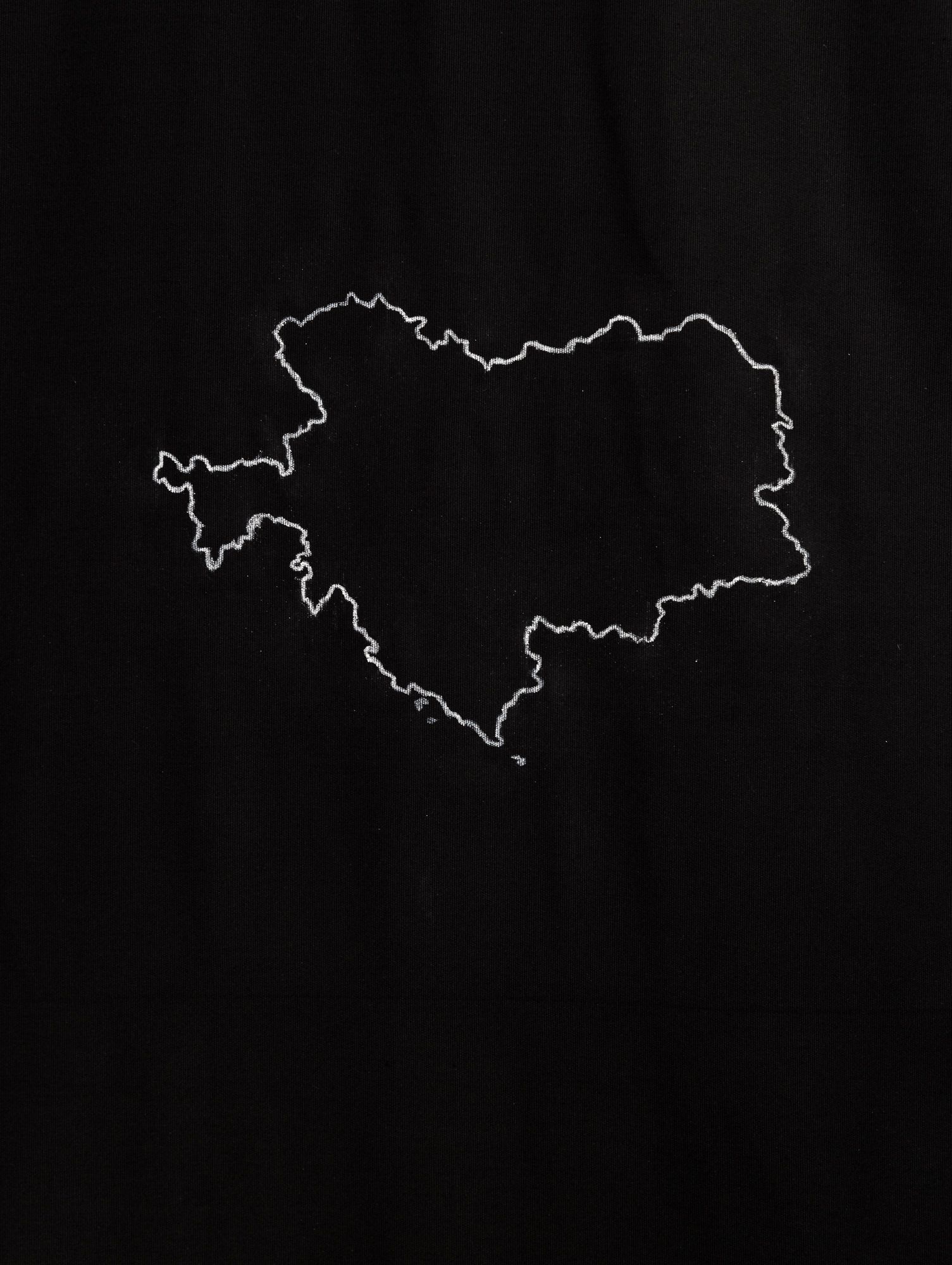 Samia Henni. Psychocolonia Spaces, Act 1. Exhibition view, Ar/Ge Kunst. Detail in photo: Chalk drawing of a 1914 map of the Austro-Hungarian Monarchy on black cotton fabric. 