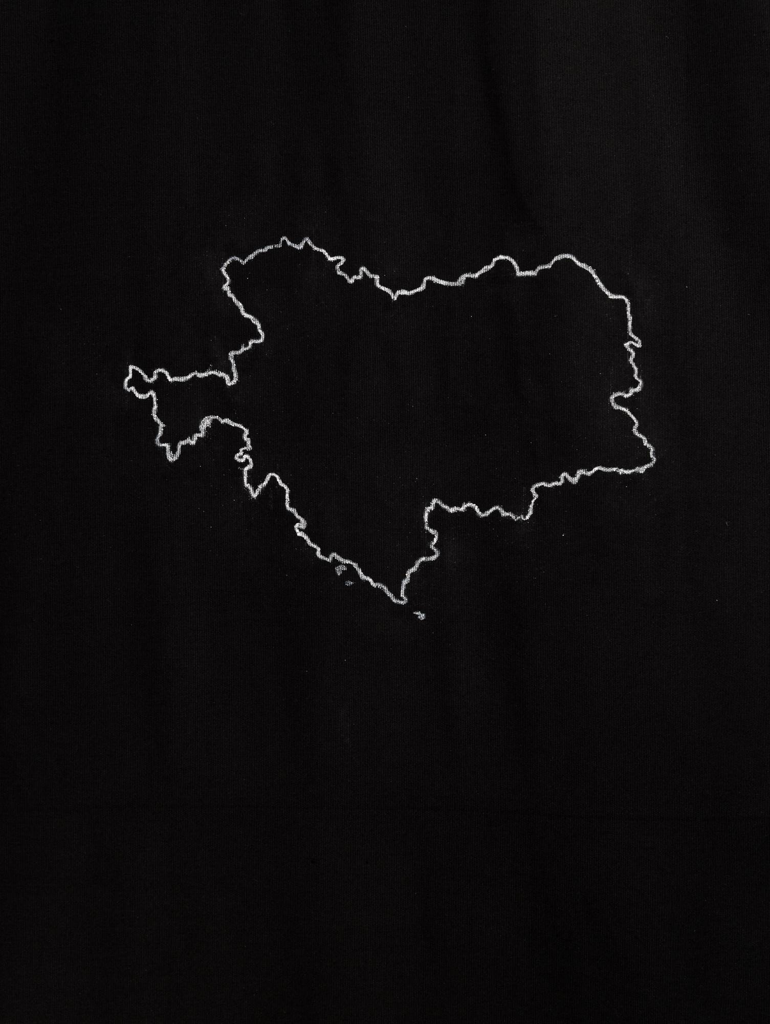 Samia Henni. Psychocolonia Spaces, Act 1. Exhibition view, Ar/Ge Kunst. Detail in photo: Chalk drawing of a 1914 map of the Austro-Hungarian Monarchy on black cotton fabric.