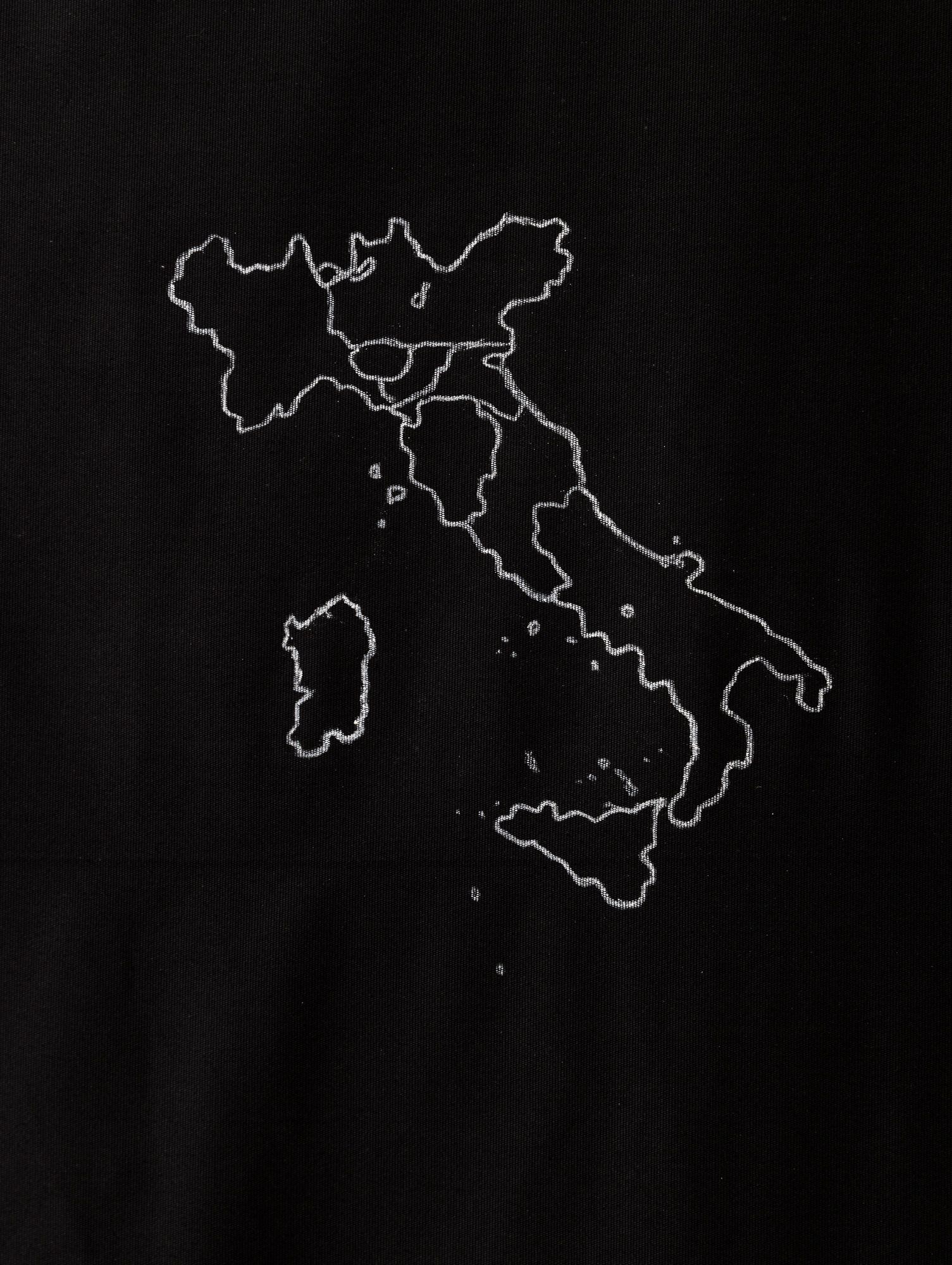 Samia Henni, Psychocolonial Spaces, Act 1. Exhibition view, Ar/Ge Kunst. Detail: Chalk drawing of a 1860 map of the Italian penisula before unification on black cotton fabric.