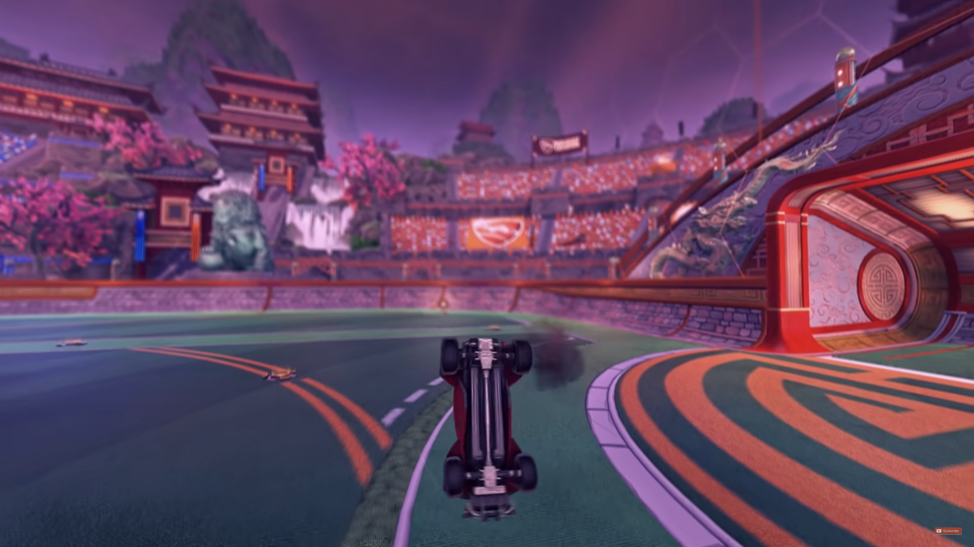 A car flying through the air with its undercarriage pointed towards the camera.