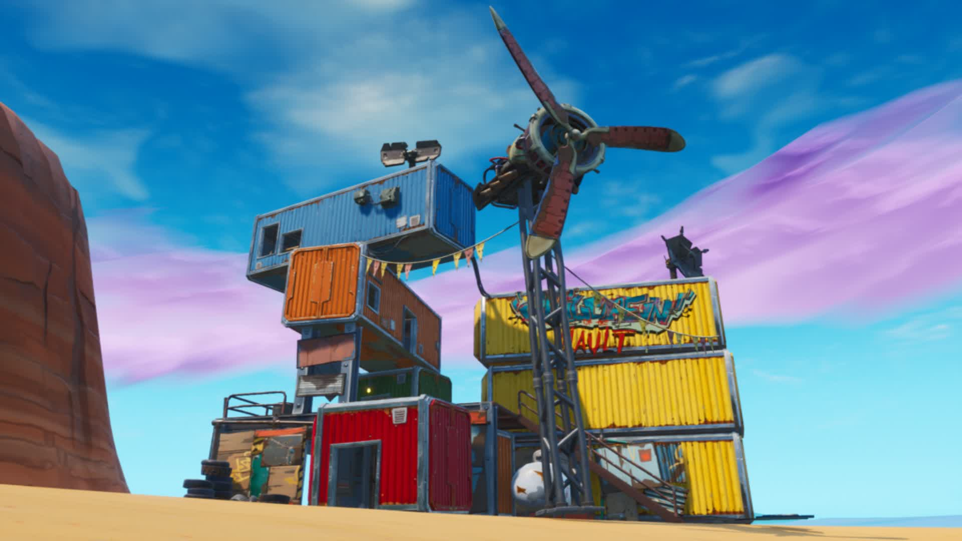 Shipping containers stacked to create a windmill, using a turboprop as the blades.