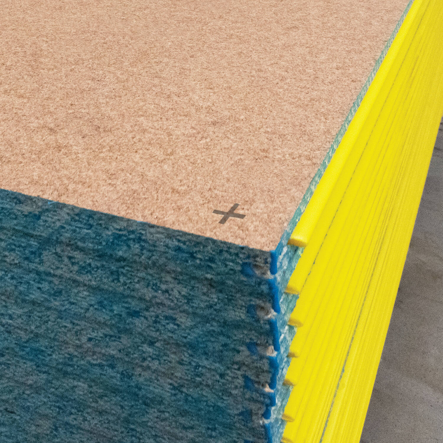 A closeup image of the corners of a stack of STRUCTAflor® termite treated boards