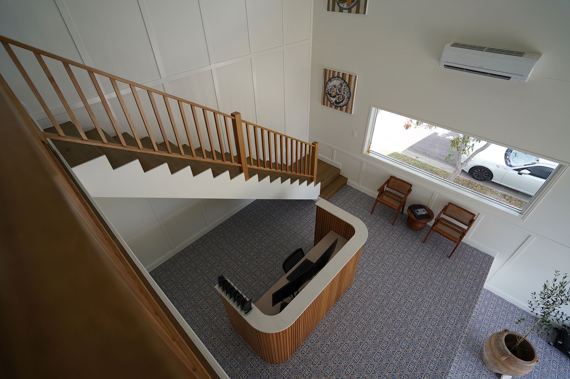 An aerial view of Townsend Constructions office space showing a staircase and reception desk