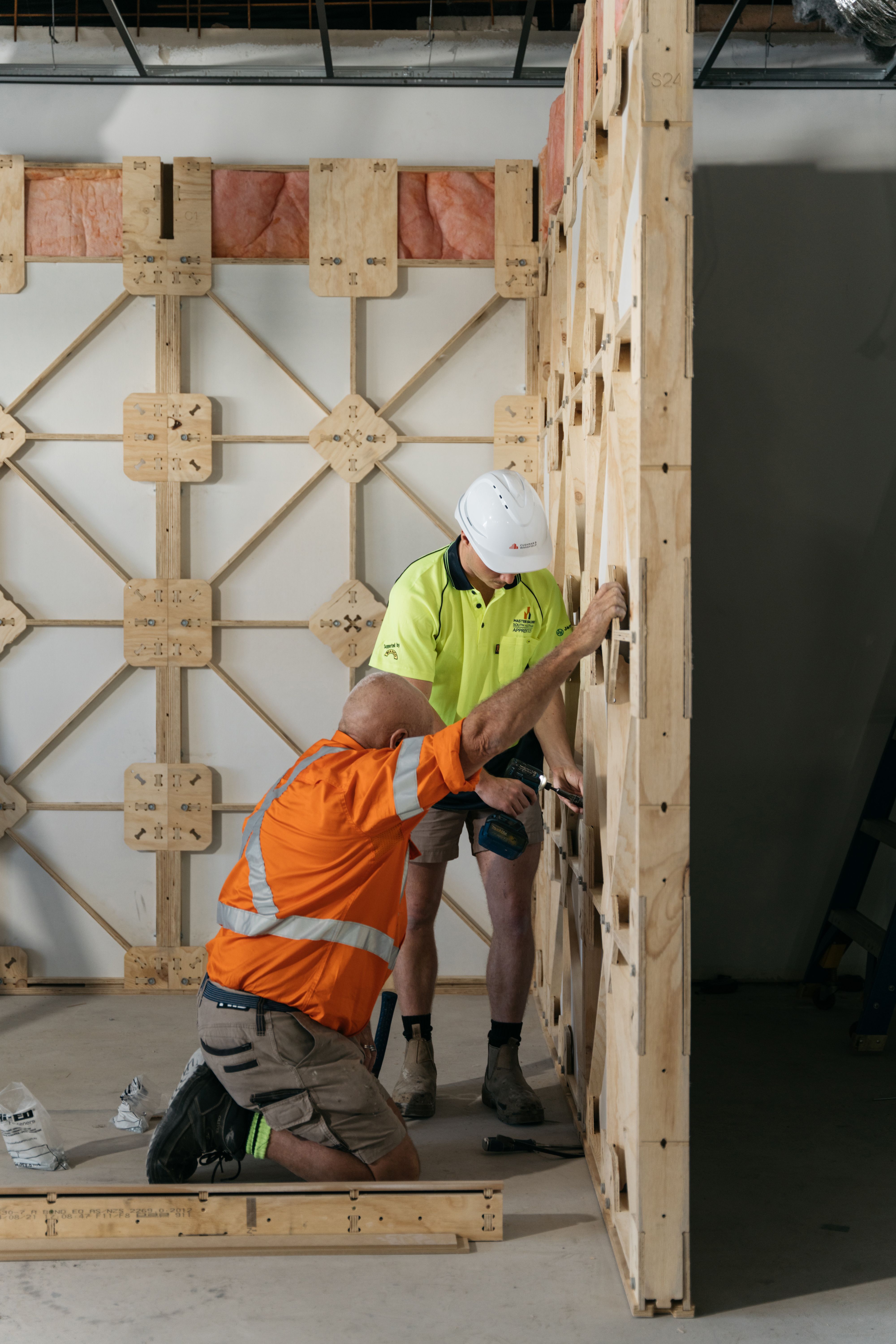 Installation of reusable STRUCTAply Square Edge framing system in ANZ retail space.