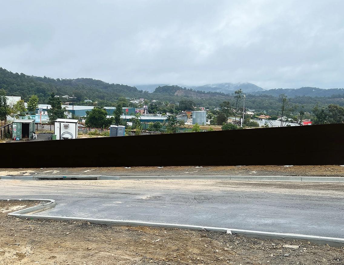 STRUCTApanel® Black installed as hoarding about a new Impact Designer Homes site