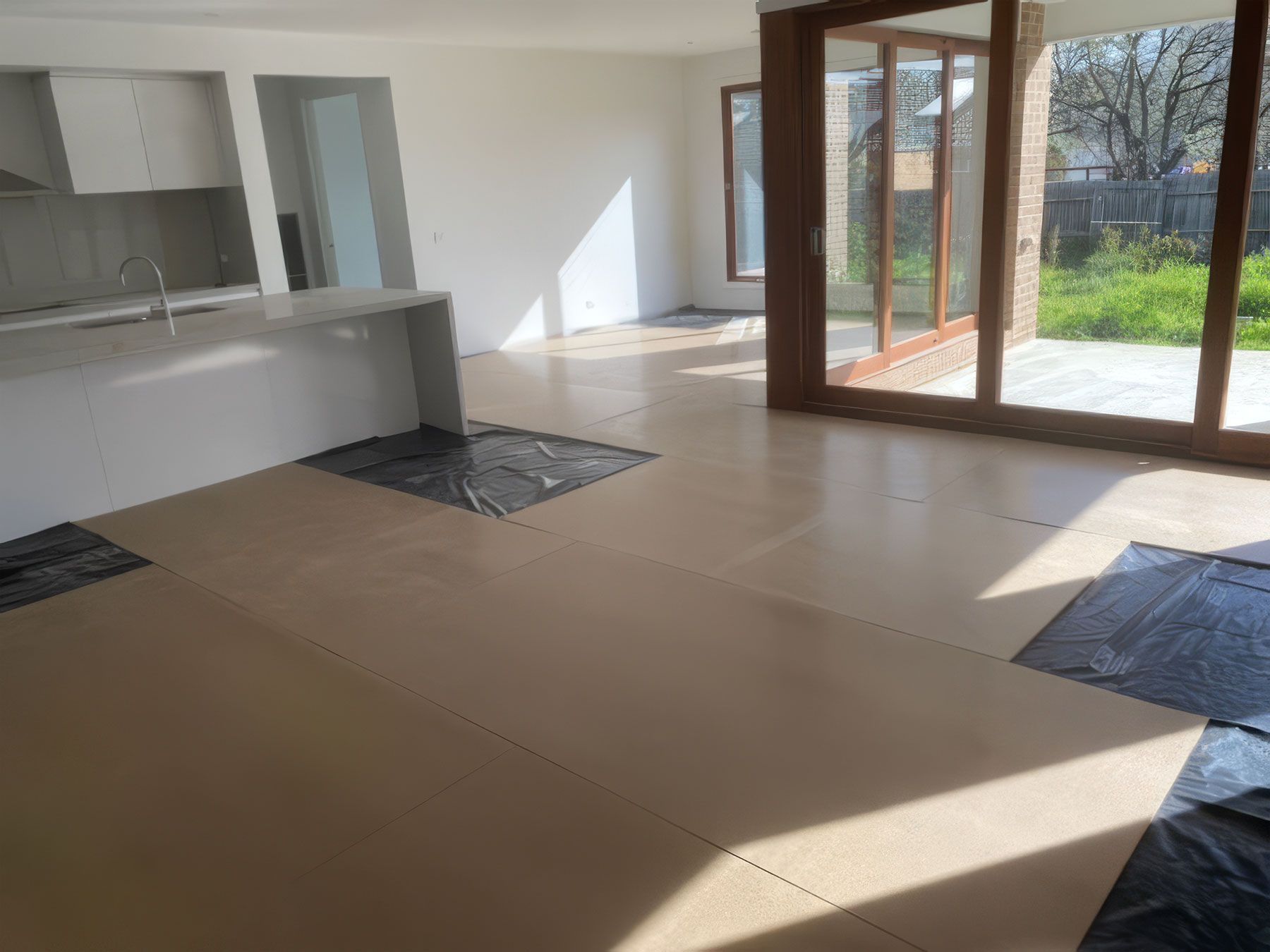 A wide view of STRUCTApanel® Smooth 12mm being installed within a kitchen area.