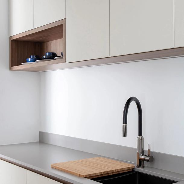 A cropped in image of a Colourpyne kitchen showing kitchen cupboards and a benchtop