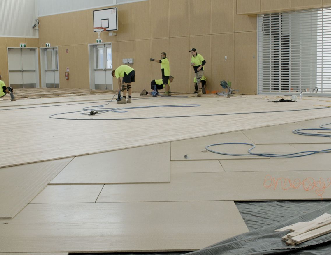Basketball timber flooring being installed over STRUCTApanel® Smooth 12mm