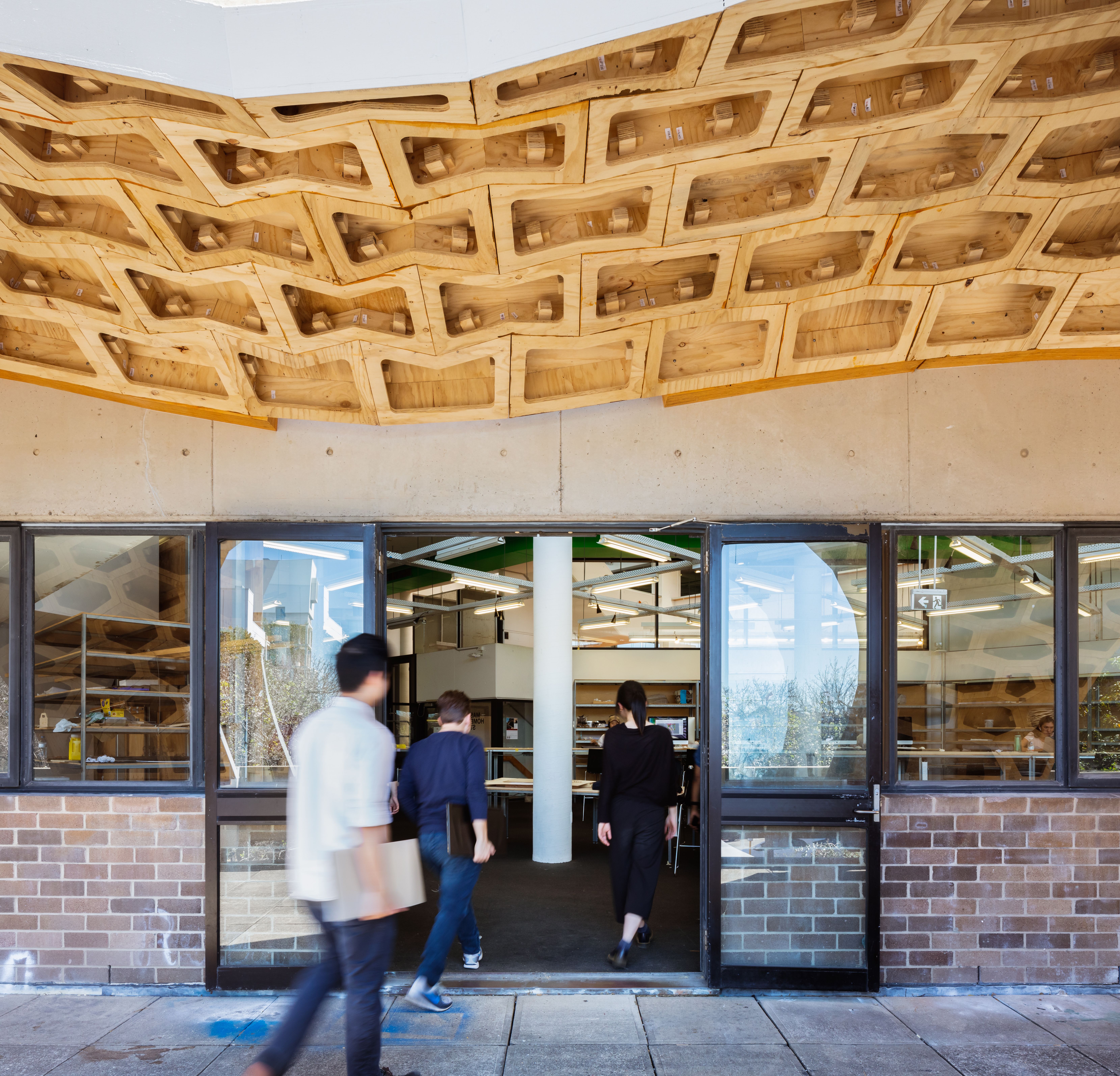 Underside view of the HexBox canopy showing polygonal plywood shell structure made from STRUCTAply.