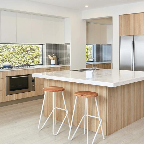 Wide shot of a colourpyne kitchen showing an island bench