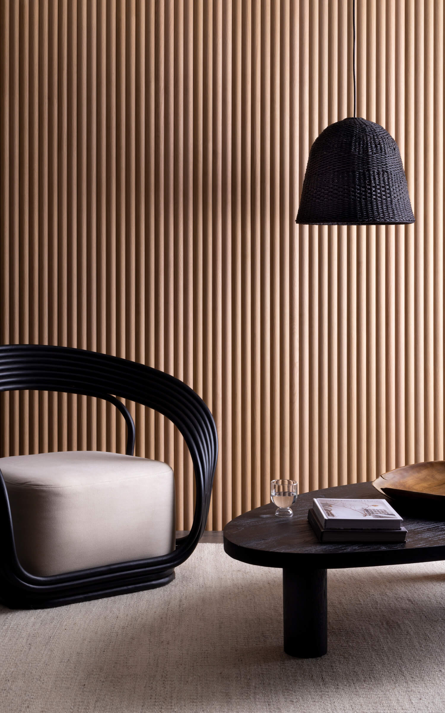 An image of a room, with a chair in the left, a coffee table and a wall covered in easycraft product