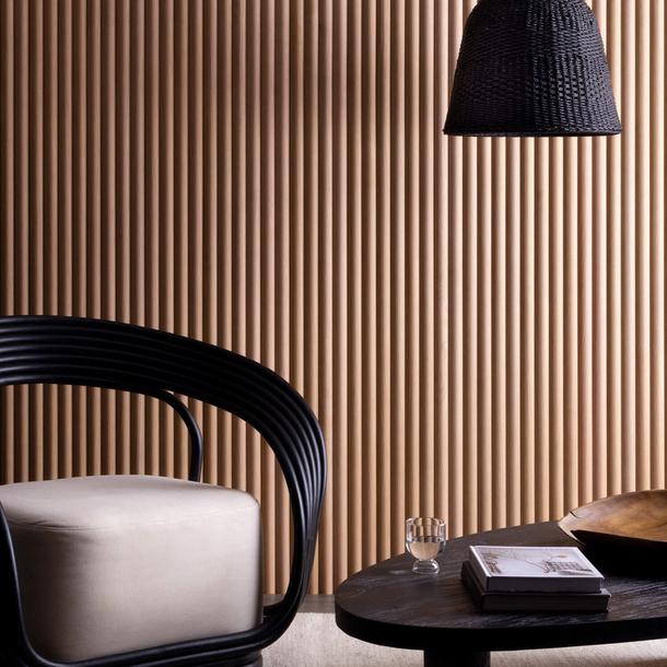 An image of a room, with a chair in the left, a coffee table and a wall covered in easycraft product