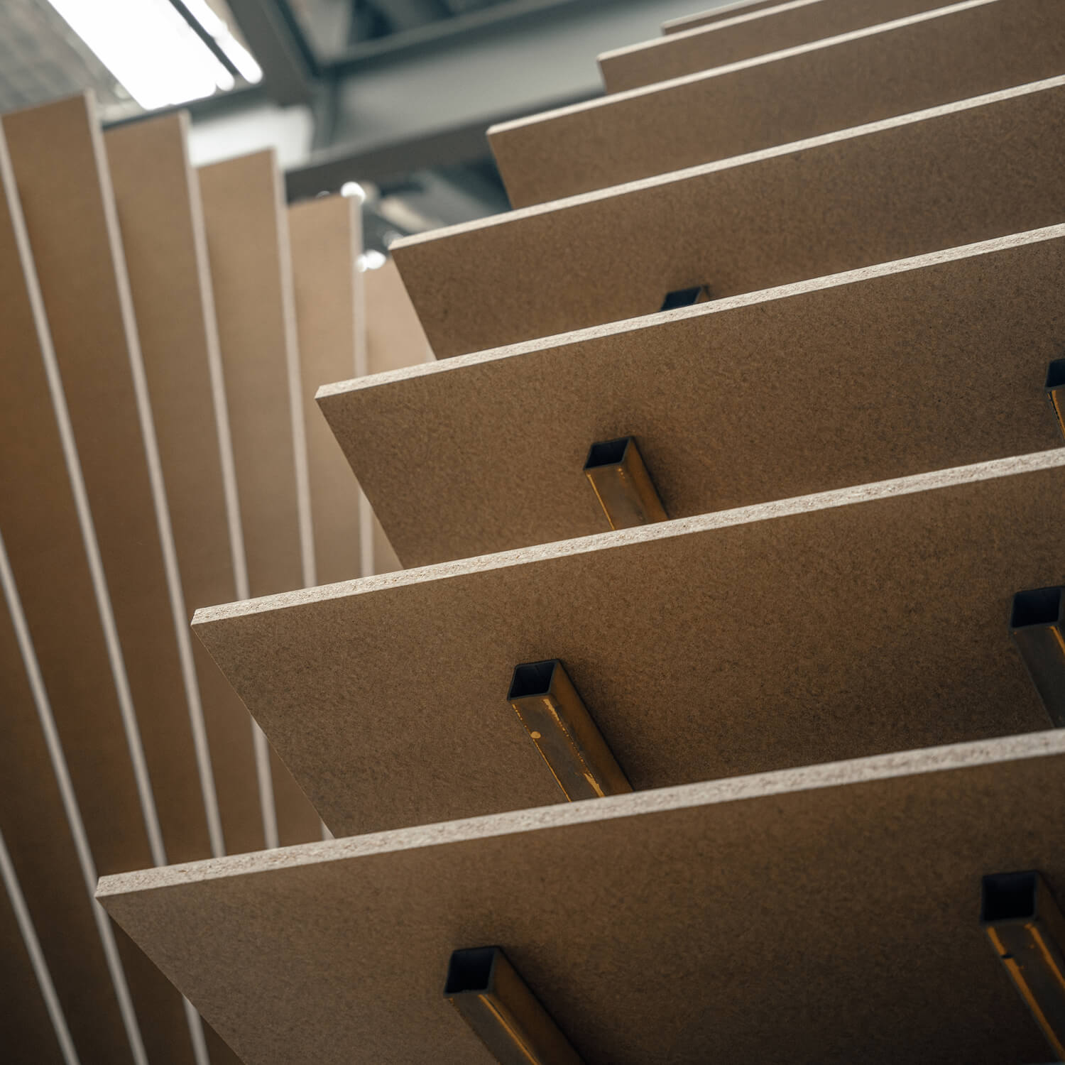 A fanned stack of particleboards drying in our oberon facility