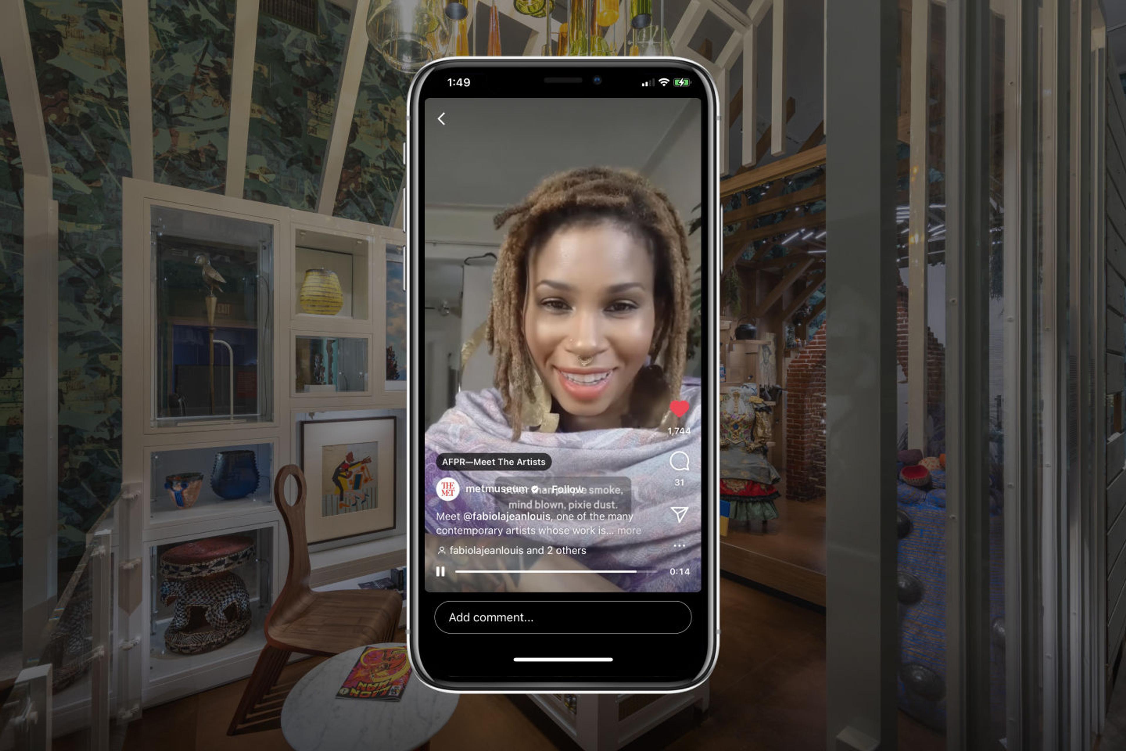 The artist Fabiola Jean-Louis visible on a phone screen before a backdrop from the Afrotuturist period room at The Met.