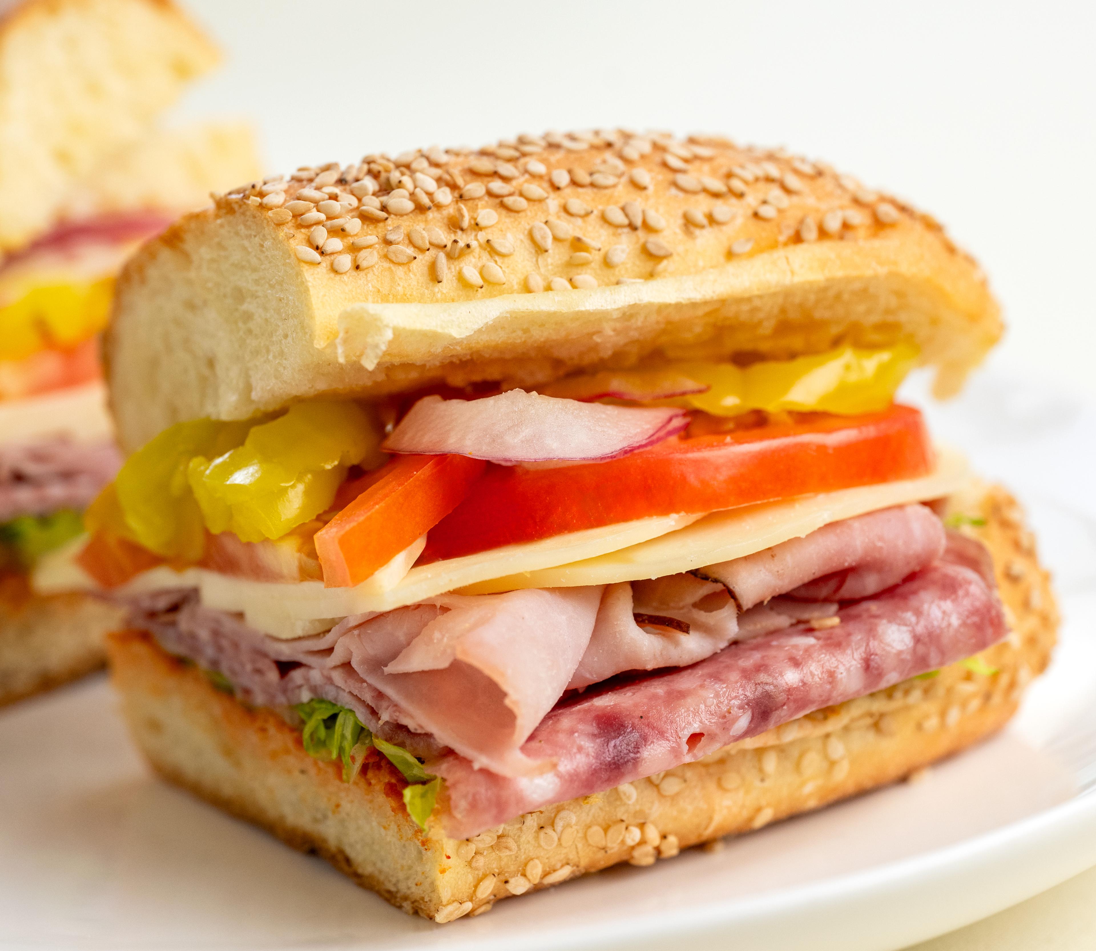 An Italian sandwich on a white plate.