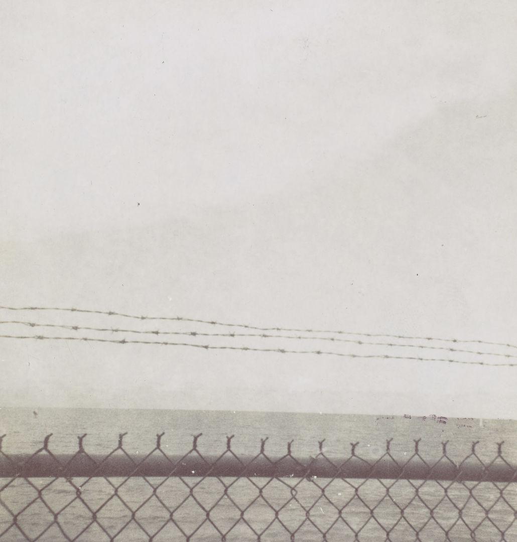 An untitled photograph by Felix Gonzales-Torres showing a coastal scene on a foggy day