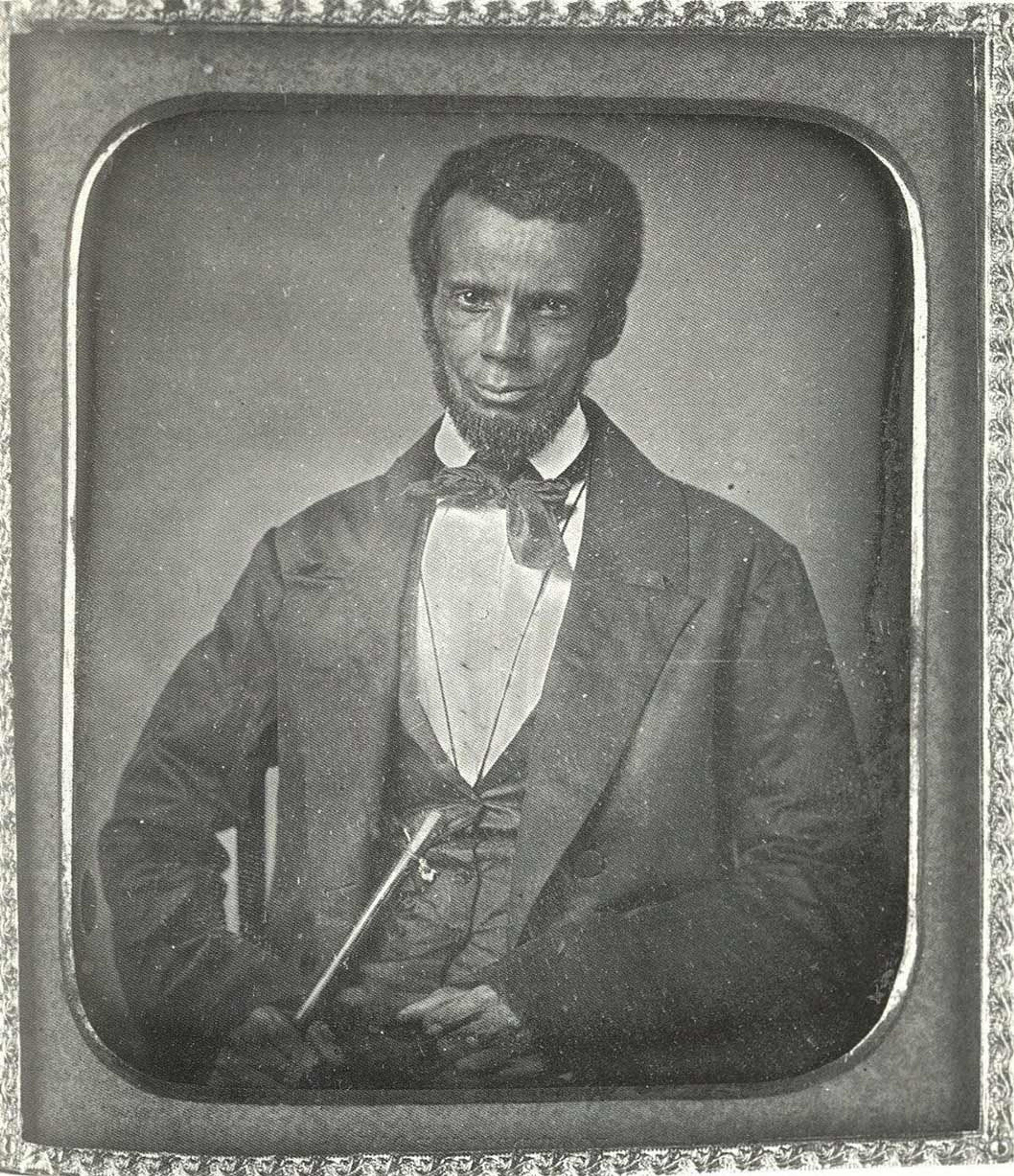 Black and white portrait of a seated man