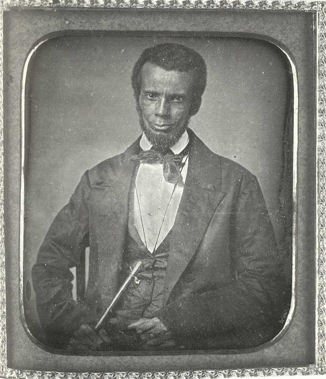 Black and white portrait of a seated man