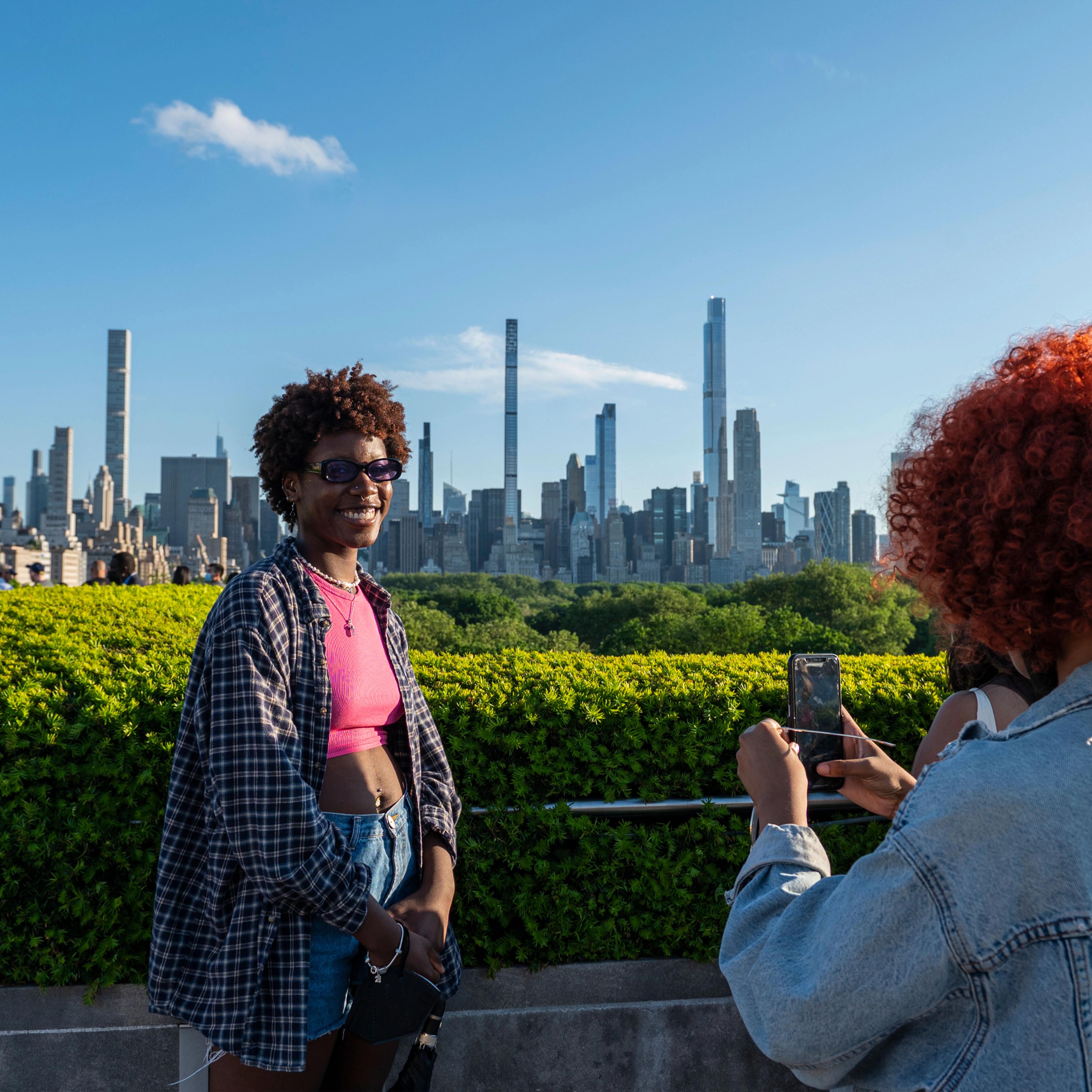 A group of people on The Met's Cantor Roof Garden 