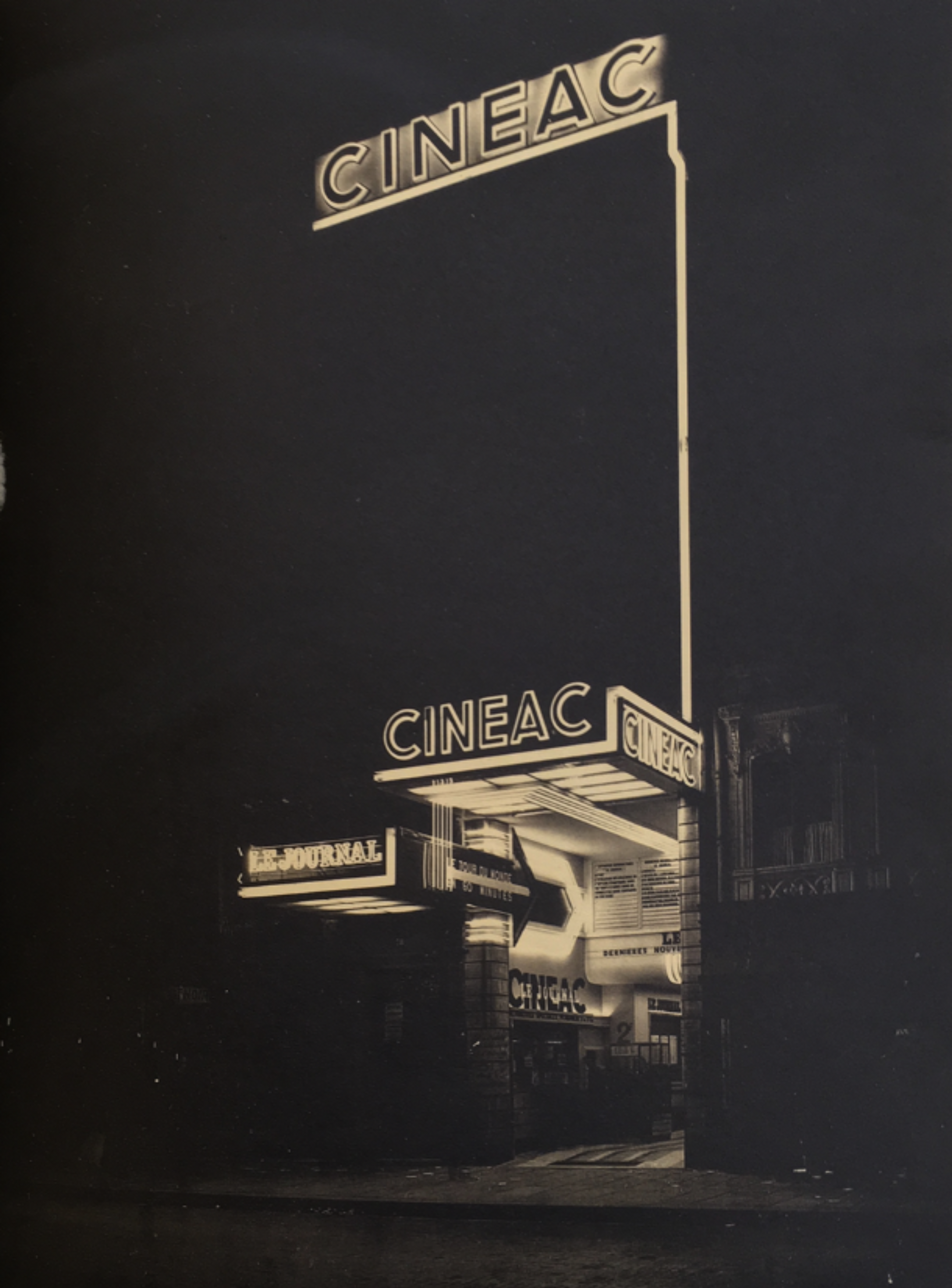Old cinema with signs reading "Cineac"